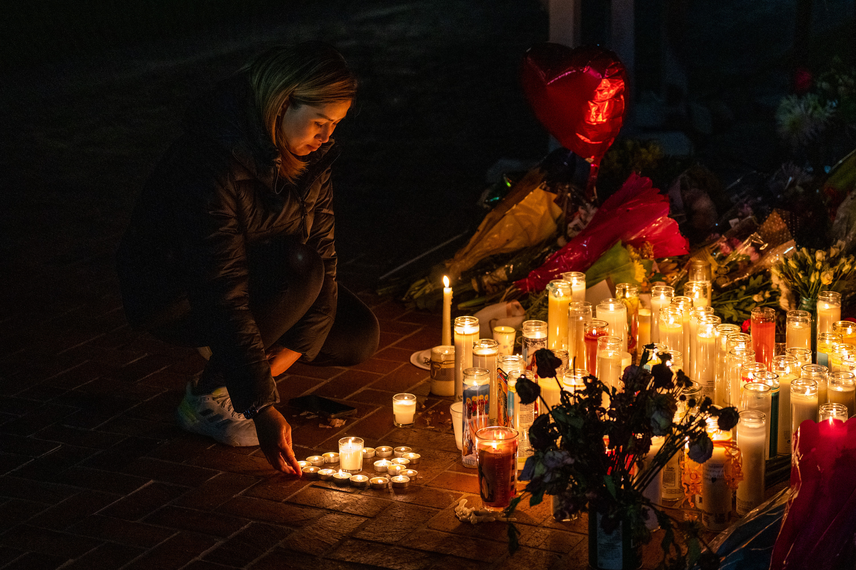 A new report from the U.S. Secret Service analyzes 173 mass attacks that took place in the country from 2016-2020. It comes just days after two shootings in California – in Monterey Park and Half Moon Bay – killed 18 people. Shown here is a mourner at a candlelight vigil for victims of the mass shooting at a dance studio in Monterey Park, Calif. (VCG via Getty Images)