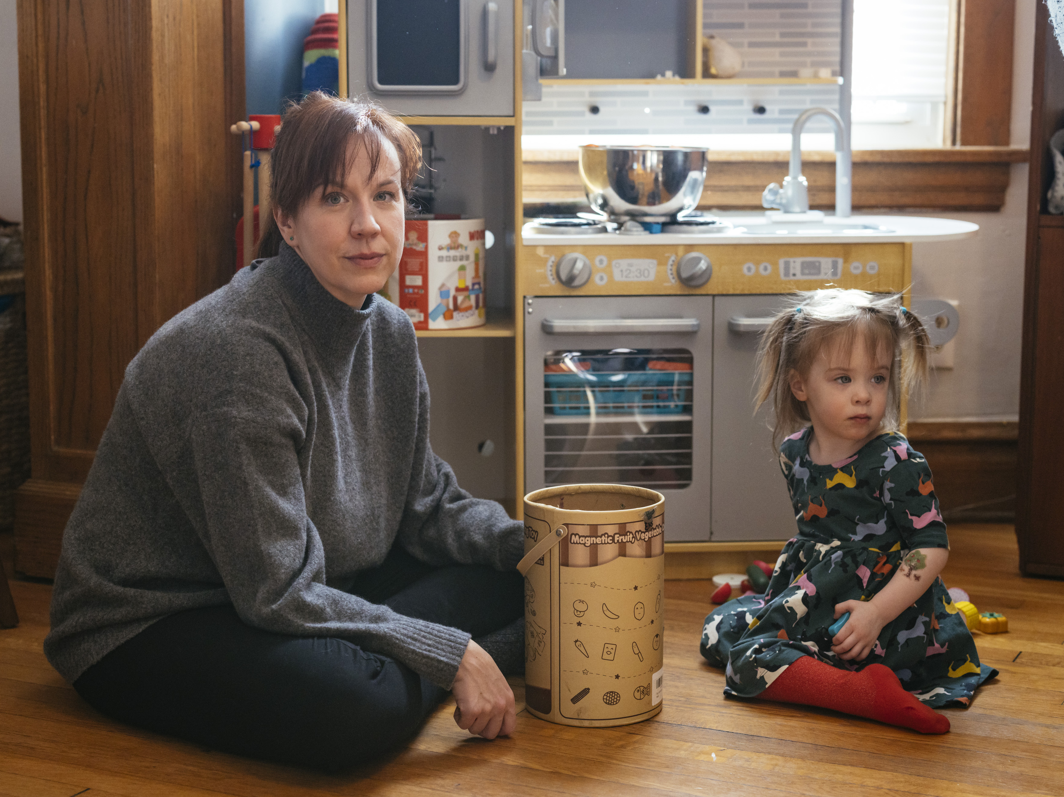 Brenna Kearney plays with her daughter, Joey, at home in Chicago. When Kearney was pregnant, she developed a rare type of preeclampsia and had to undergo an emergency cesarean section. Joey was discharged after a 36-day stay in the NICU. (Taylor Glascock for KHN)