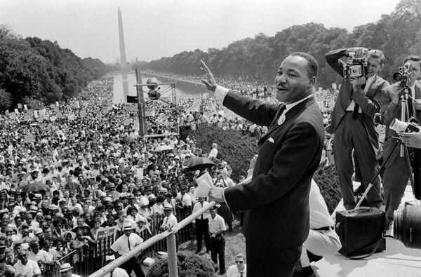 The civil rights leader Martin Luther King Jr. waves to supporters on Aug. 28, 1963, on the Mall in Washington, D.C., during the March on Washington.