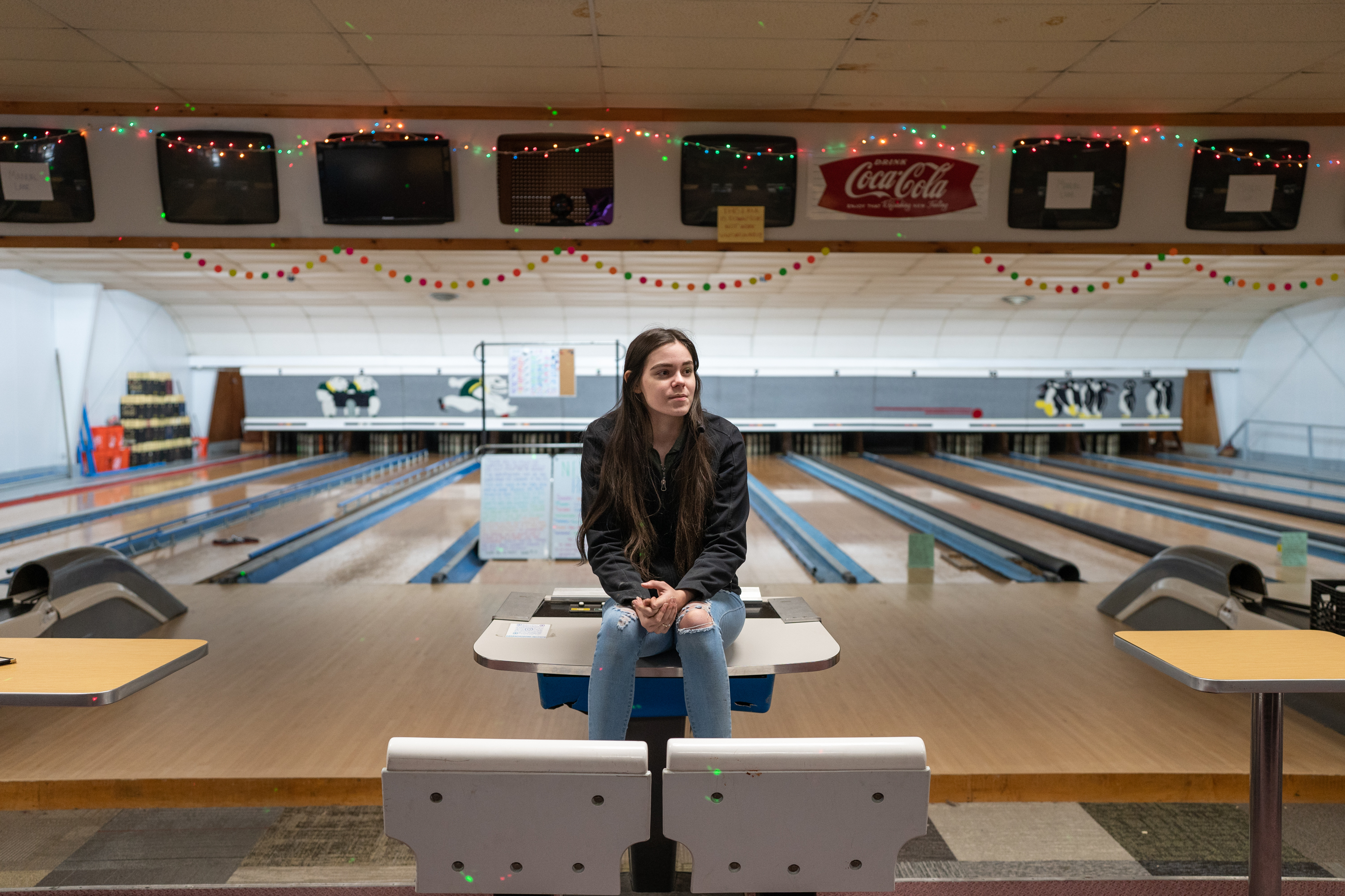 Autumn Mowery, 20, operates the candlepin bowling alley in Ellsworth, Maine.  She has been running the place by herself and needs to update the bowling alley's machinery in order to be able to hire any employees. (Sofia Aldinio for NPR)