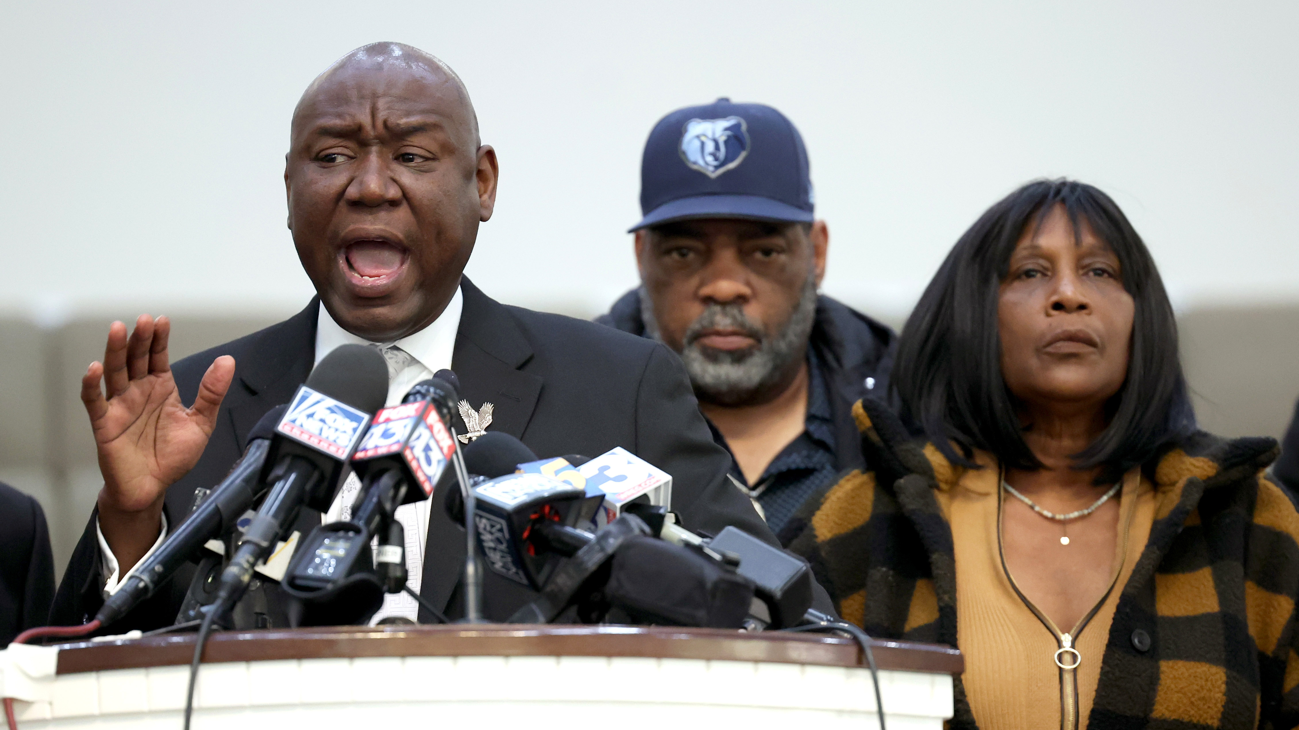 Flanked by Rodney Wells and RowVaughn Wells, the stepfather and mother of Tyre Nichols, civil rights attorney Ben Crump speaks during a press conference in Memphis, Tennessee on January 27, 2023. Tyre Nichols, a 29-year-old Black man, died three days after being severely beaten by five Memphis Police Department officers during a traffic stop on January 7, 2023. (Scott Olson/Getty Images)