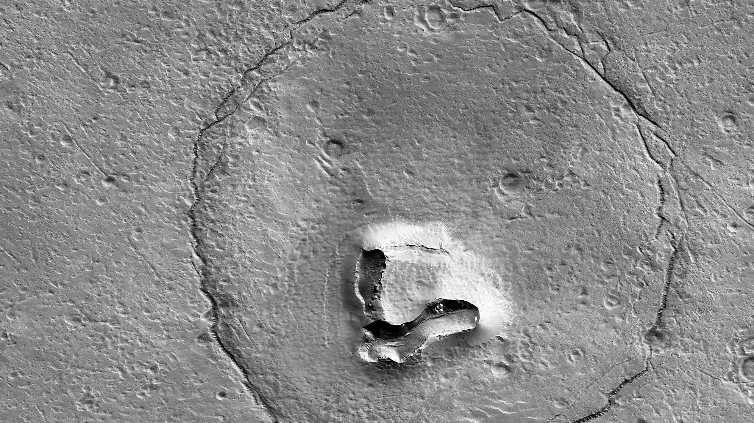 The University of Arizona shared an image, pictured, of a formation on Mars that resembles a bear.