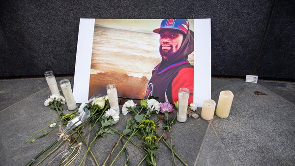 A memorial is displayed for Tyre Nichols at the Embrace statue in Boston, Massachusetts, on January 28, 2023.
