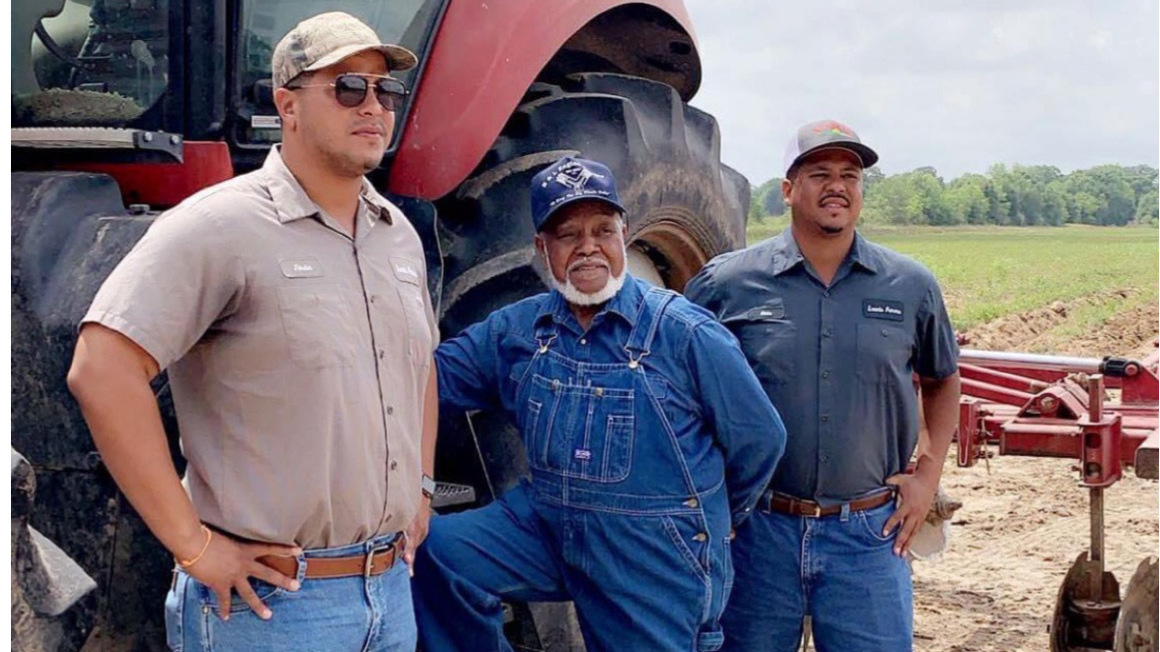 Jordan Lewis, Eddie Lewis Sr. and Eddie Lewis III standing on the ground of their Louisiana farm.