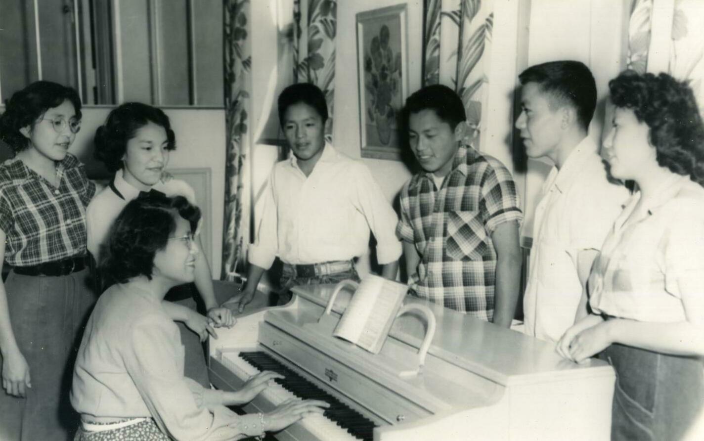 Students "singing old songs" at Keechi Cottage at Riverside in 1954.