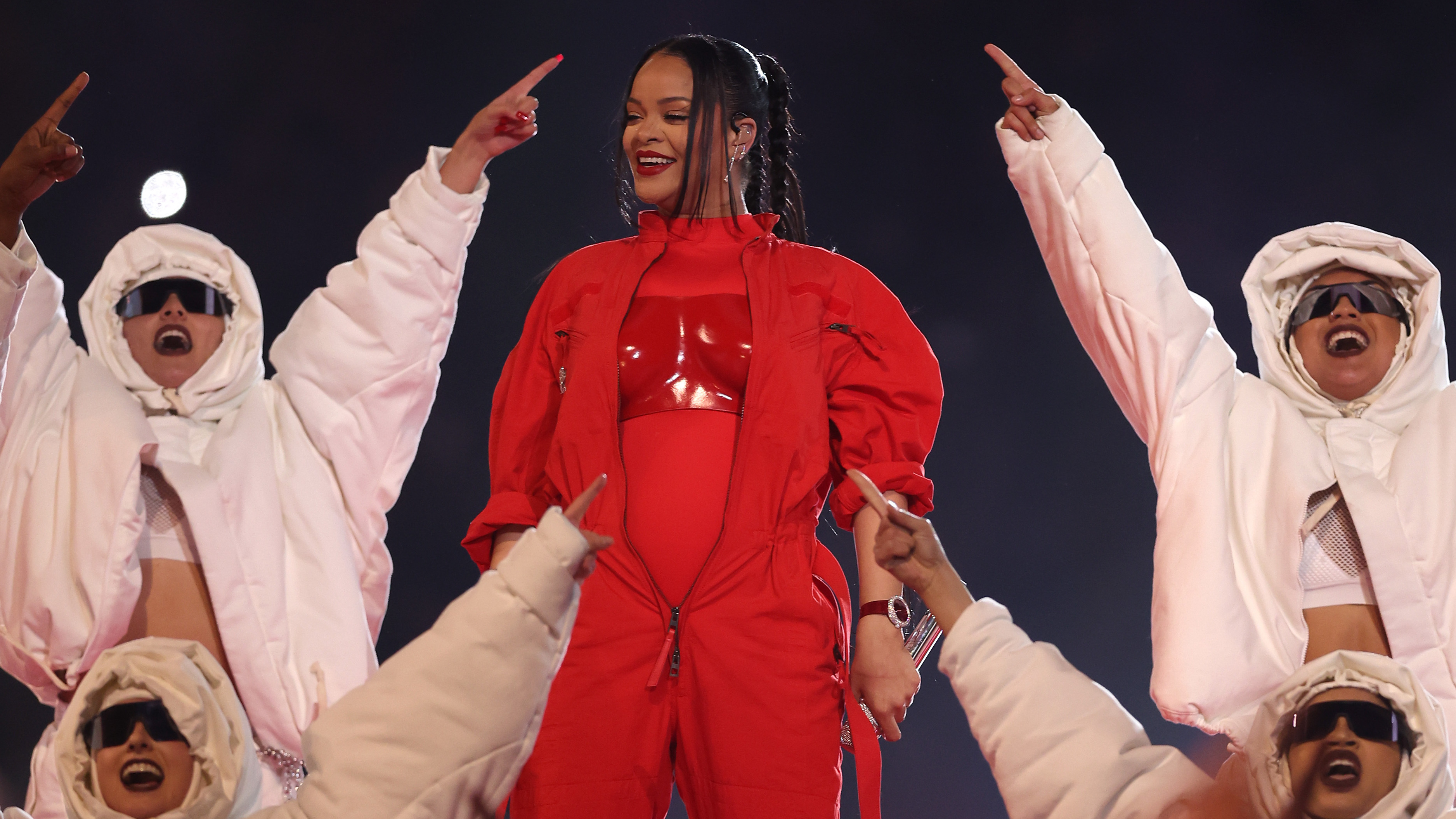 Rihanna performs onstage during the Super Bowl halftime show on Sunday night. Her performance doubled as a pregnancy reveal.