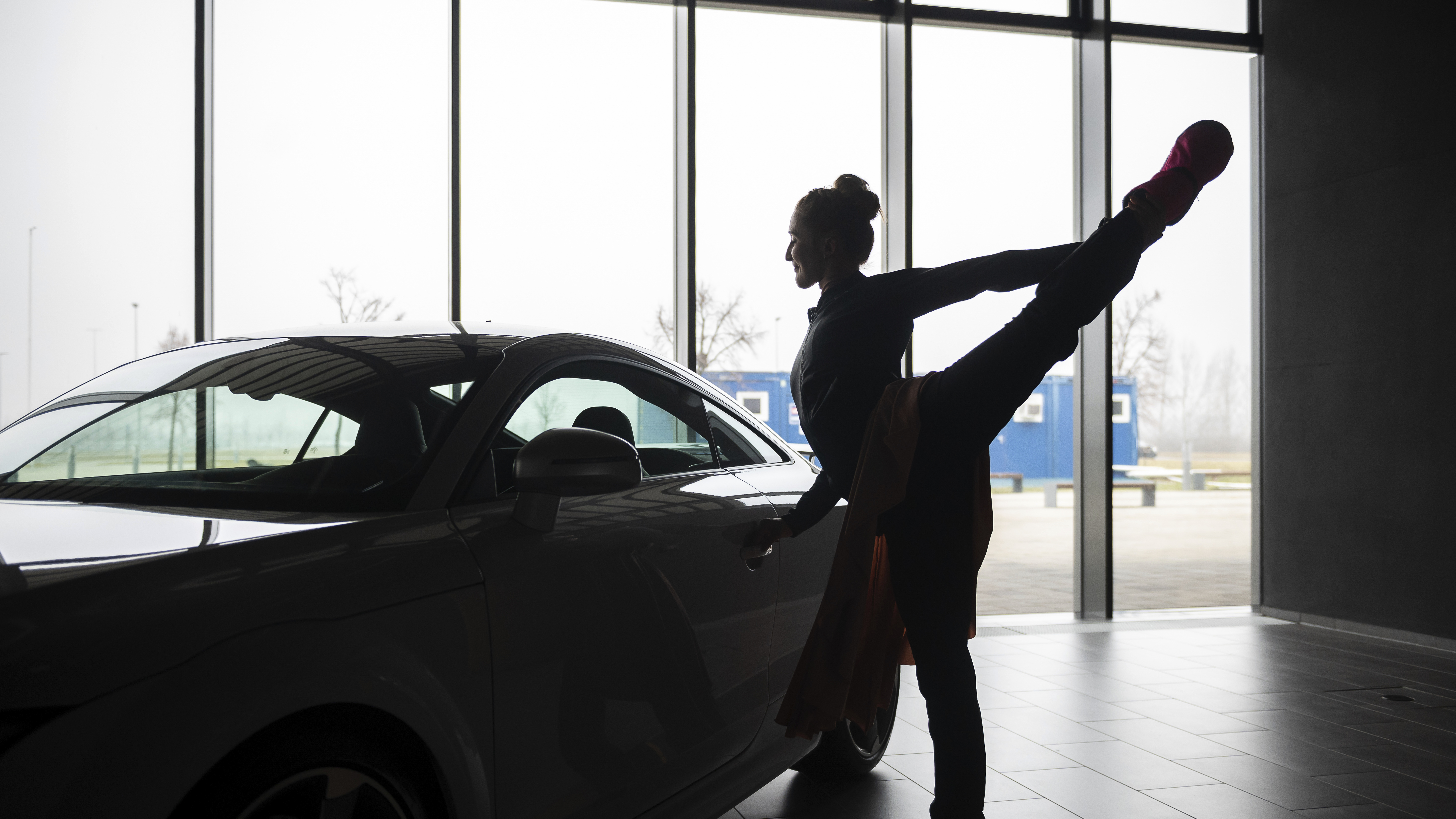 A ballet dancer warms up before an open rehearsal at the Audi automobile factory in Gyor, Hungary, on Thursday. The Ballet Company of Gyor is rehearsing at the factory after being forced to shutter its rehearsal hall in response to soaring energy prices.