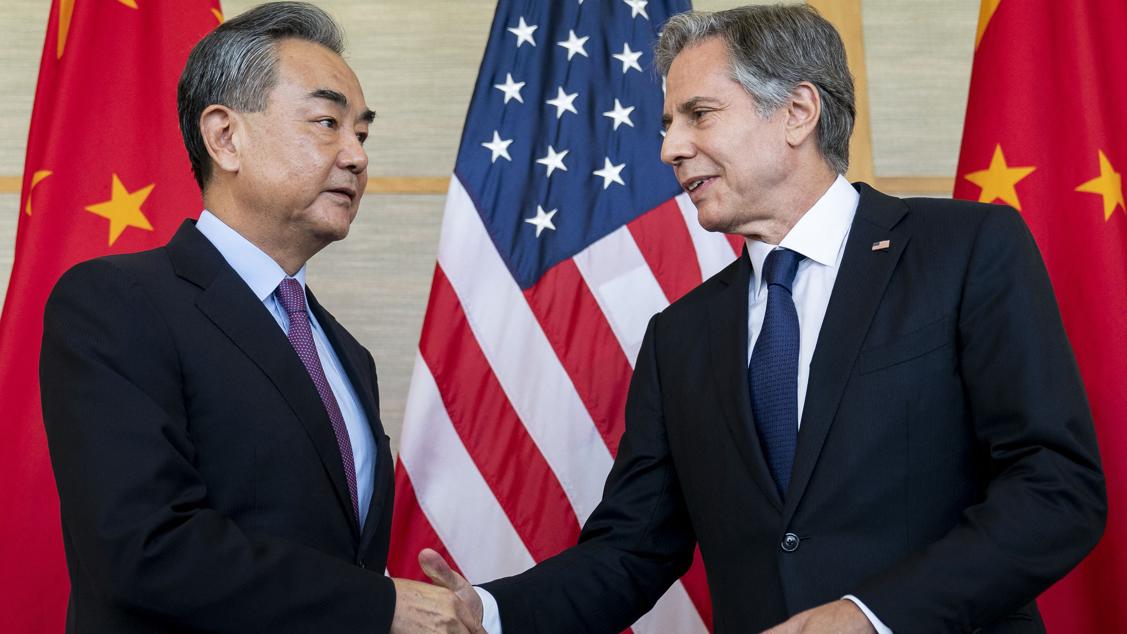 U.S. Secretary of State Antony Blinken shakes hands with China