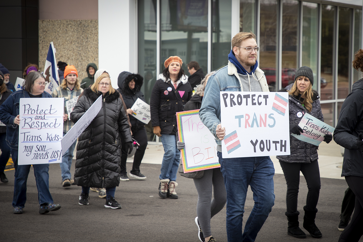 Protestors calling for LGBTQ rights stand outside a Pizza Ranch in Cedar Rapids, Iowa, where former Vice President Mike Pence is speaking on Feb. 15, 2023. (Iowa Public Radio)