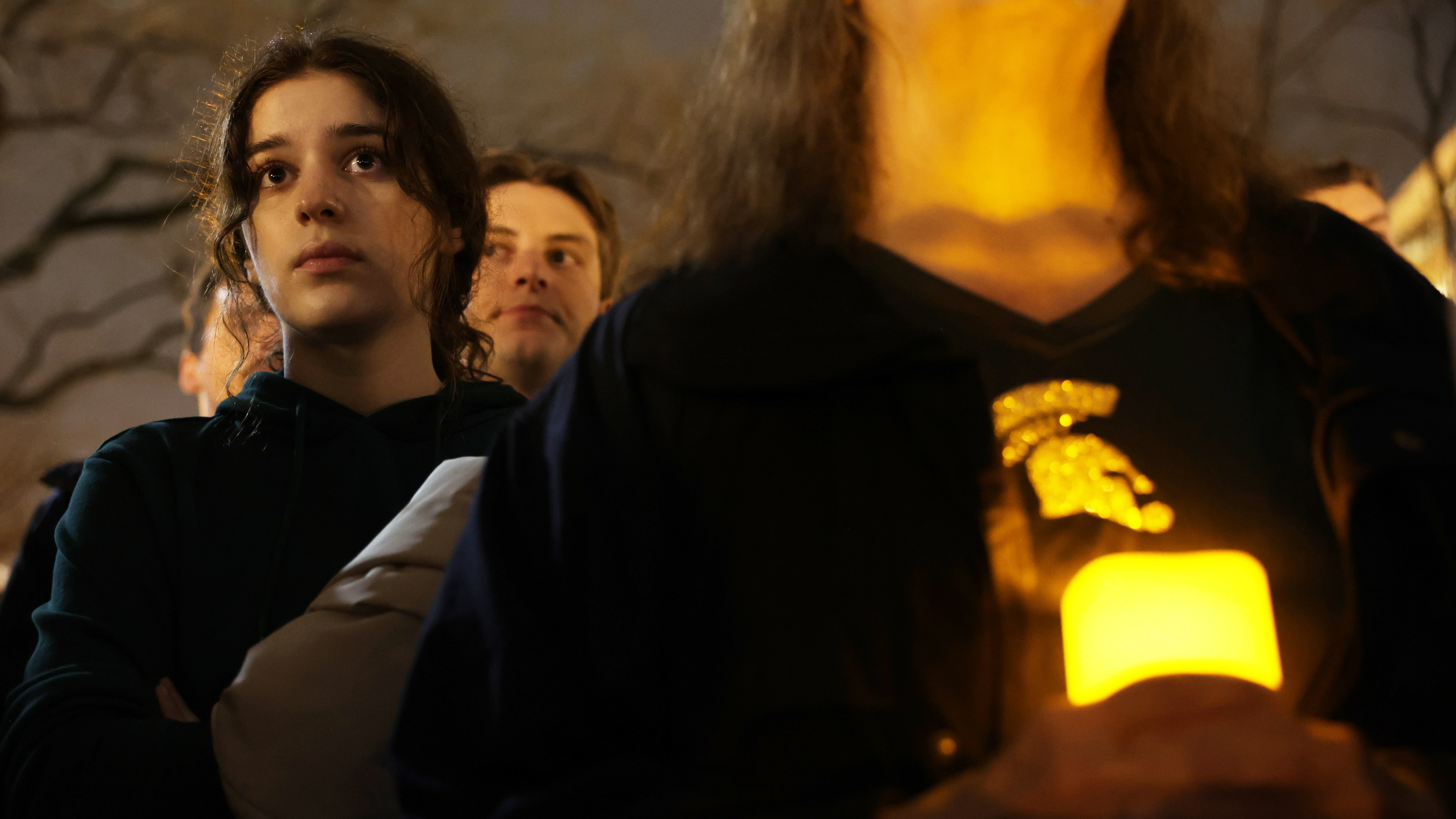 People attend a candlelight vigil, for the victims of a shooting at Michigan State University, on Feb. 16. Classes are scheduled to resume days later.