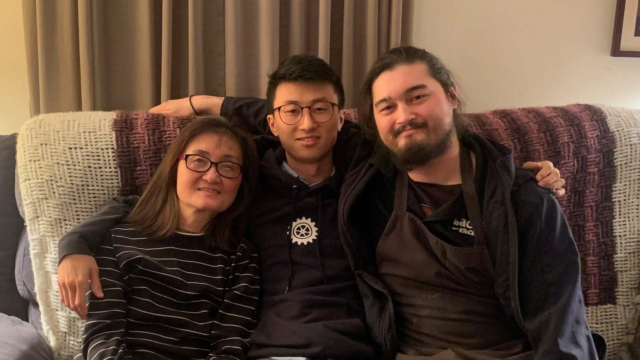 Director Bing Liu (center) with his mother and step brother.