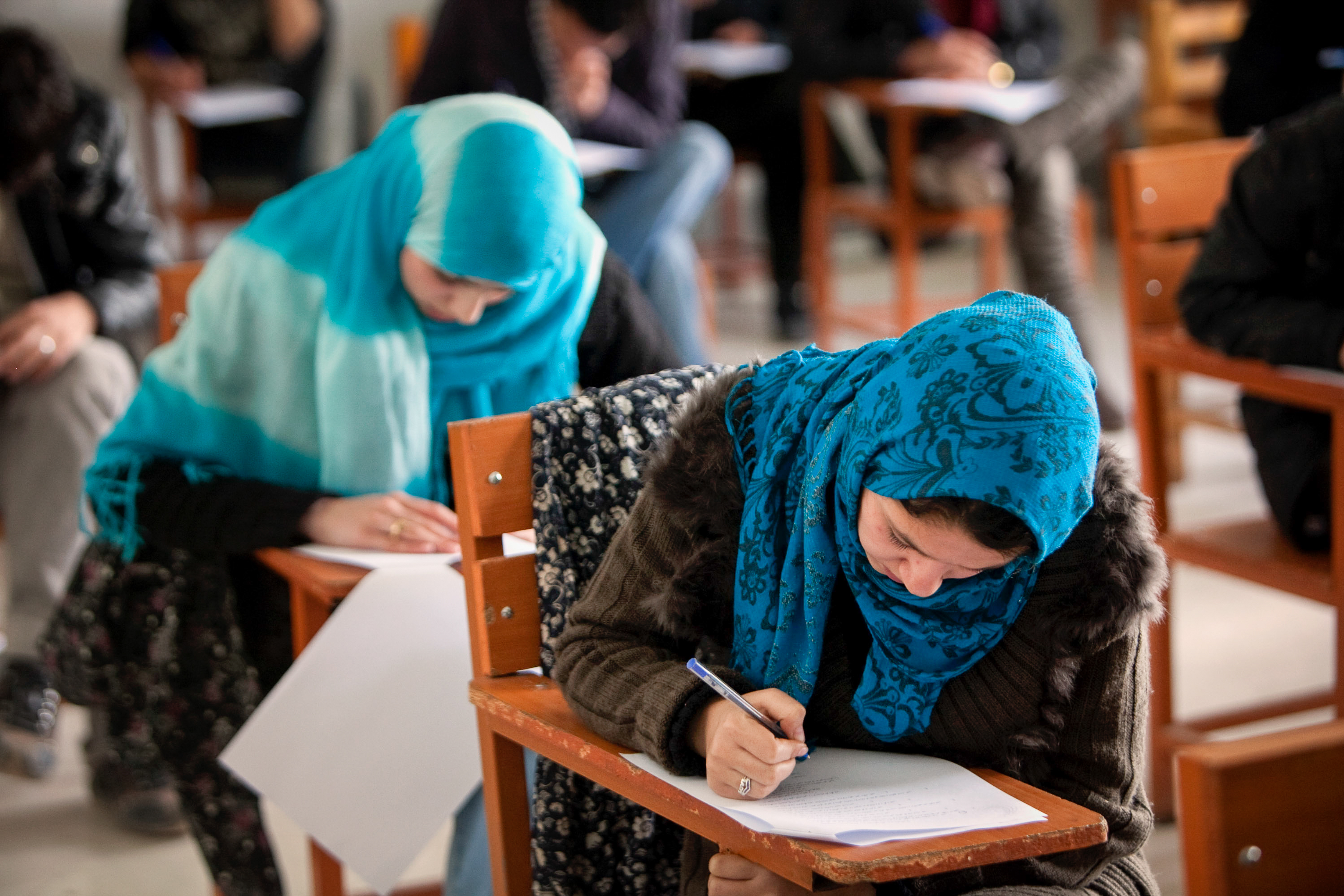 In December, the Taliban banned female students from attending university. Some of them are turning to online options. Above: Afghan female students attend Kabul University in 2010. (Majid Saeedi/Getty Images)