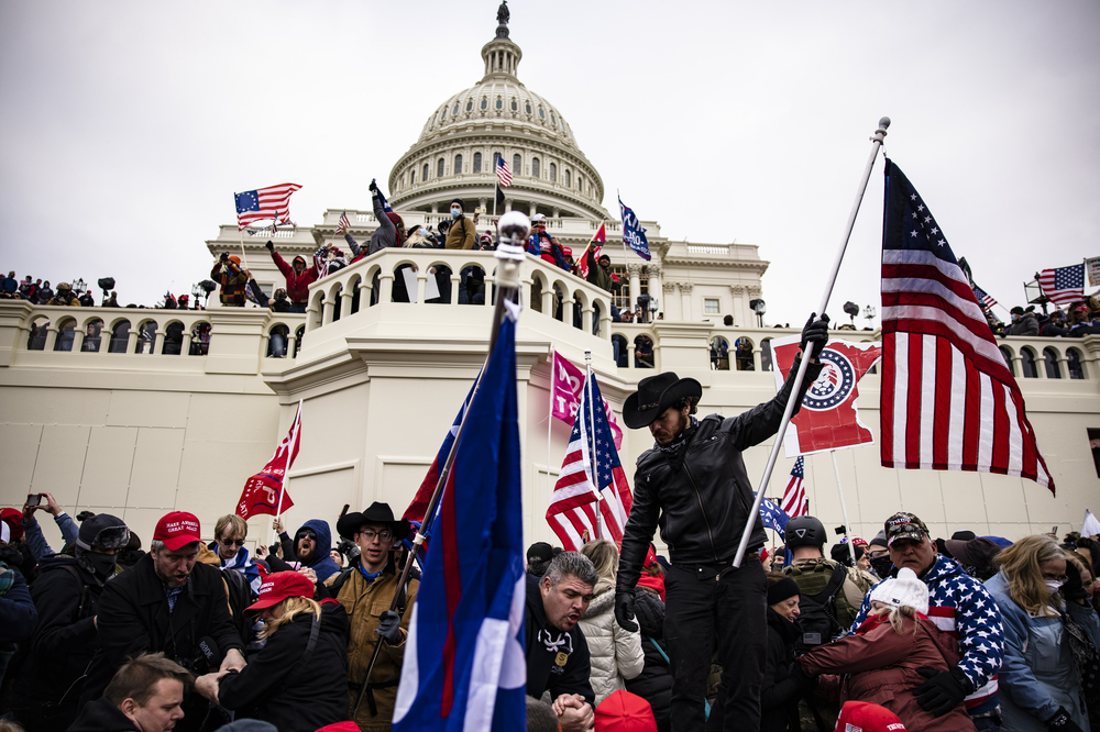 A crowd of pro-Trump supporters storm the U.S. Capitol on Jan. 6, 2021. Senate Majority Leader Chuck Schumer is warning against the release of security footage from during the Capitol attack to Fox News host Tucker Carlson. (Getty Images)