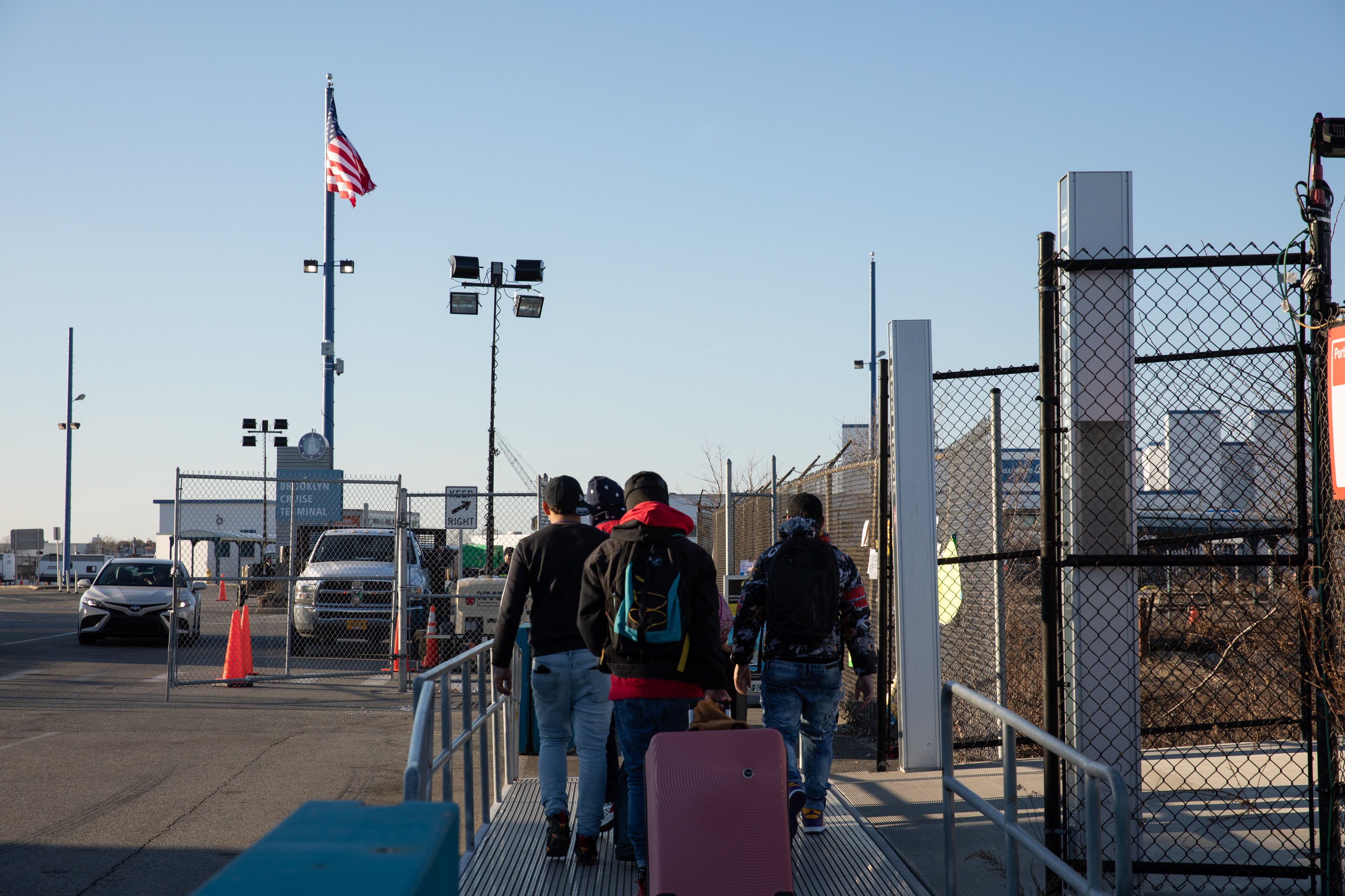 Migrants entering a cruise ship terminal in Brooklyn which was repurposed into a housing center. (Salvador Espinoza for NPR)