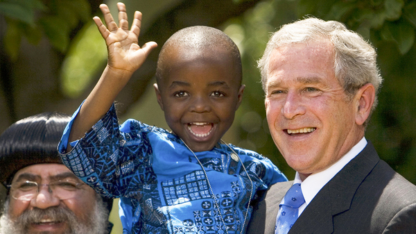 In 2003, President George W. Bush created PEPFAR to help countries tackle the HIV/AIDS crisis. Four years later, he spoke at the Rose Garden to urge lawmakers to set aside $30 billion for the cause over the next 5 years. Joining him were Kunene Tantoh of South Africa and her 4-year-old son (pictured). Tantoh, who is HIV-positive, coordinated a U.S.-funded mentoring program for mothers with HIV.