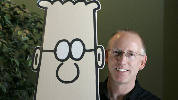 Scott Adams, creator of the comic strip "Dilbert," poses for a portrait with the Dilbert character in his studio in Dublin, Calif., in 2006. Several prominent media publishers across the U.S. are dropping the comic strip after Adams described people who are Black as members of "a racist hate group" during an online video show.