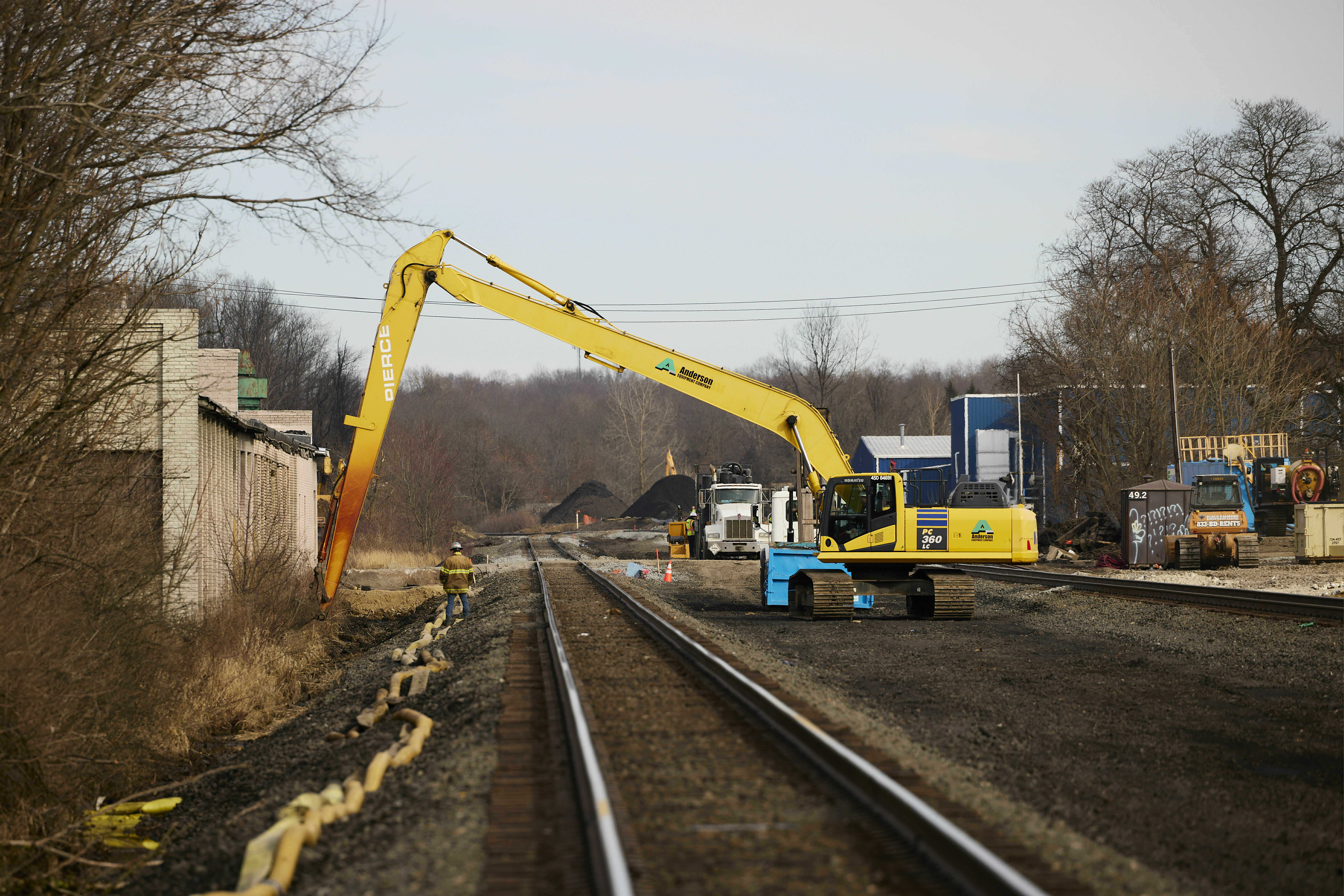 Workers remove contaminated dirt near the railroad tracks on February 14, 2023 in East Palestine, Ohio. (Getty Images)