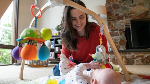 Danielle Laskey at her home just outside Seattle, with her infant son. Before giving birth, Laskey experienced a serious pregnancy complication and was admitted for a seven-week hospital stay, plus a follow-up postpartum procedure.