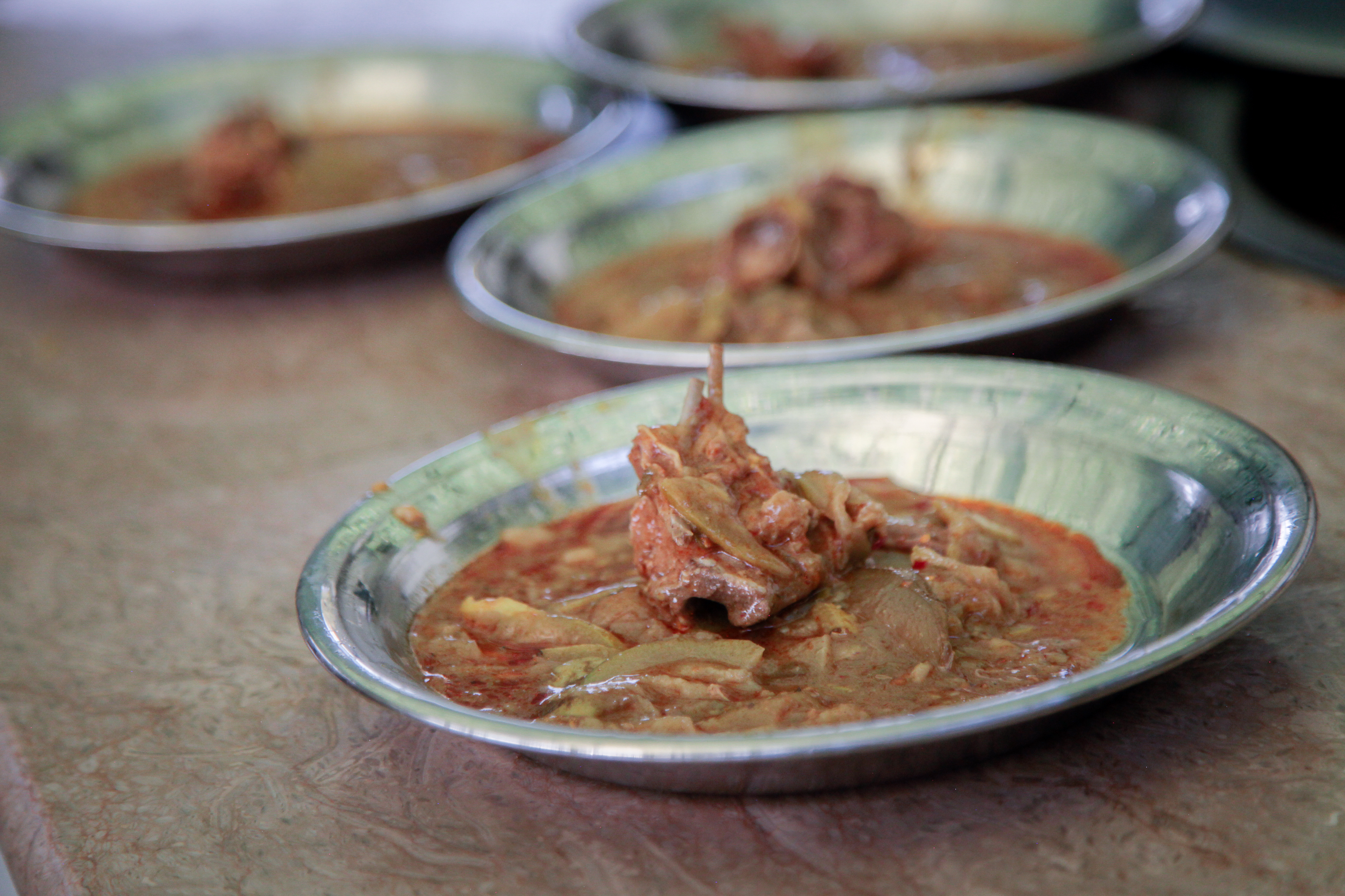 Meals of goat curry are served at a free cafeteria operated by the Pakistani charity Saylani. This cafeteria was recently opened to serve workers in the textile mills on the outskirts of the city of Faisalabad. It's one of 40 cafeterias the charity runs in Faisalabad – nearly double what they operated two years ago as the number of hungry grow.