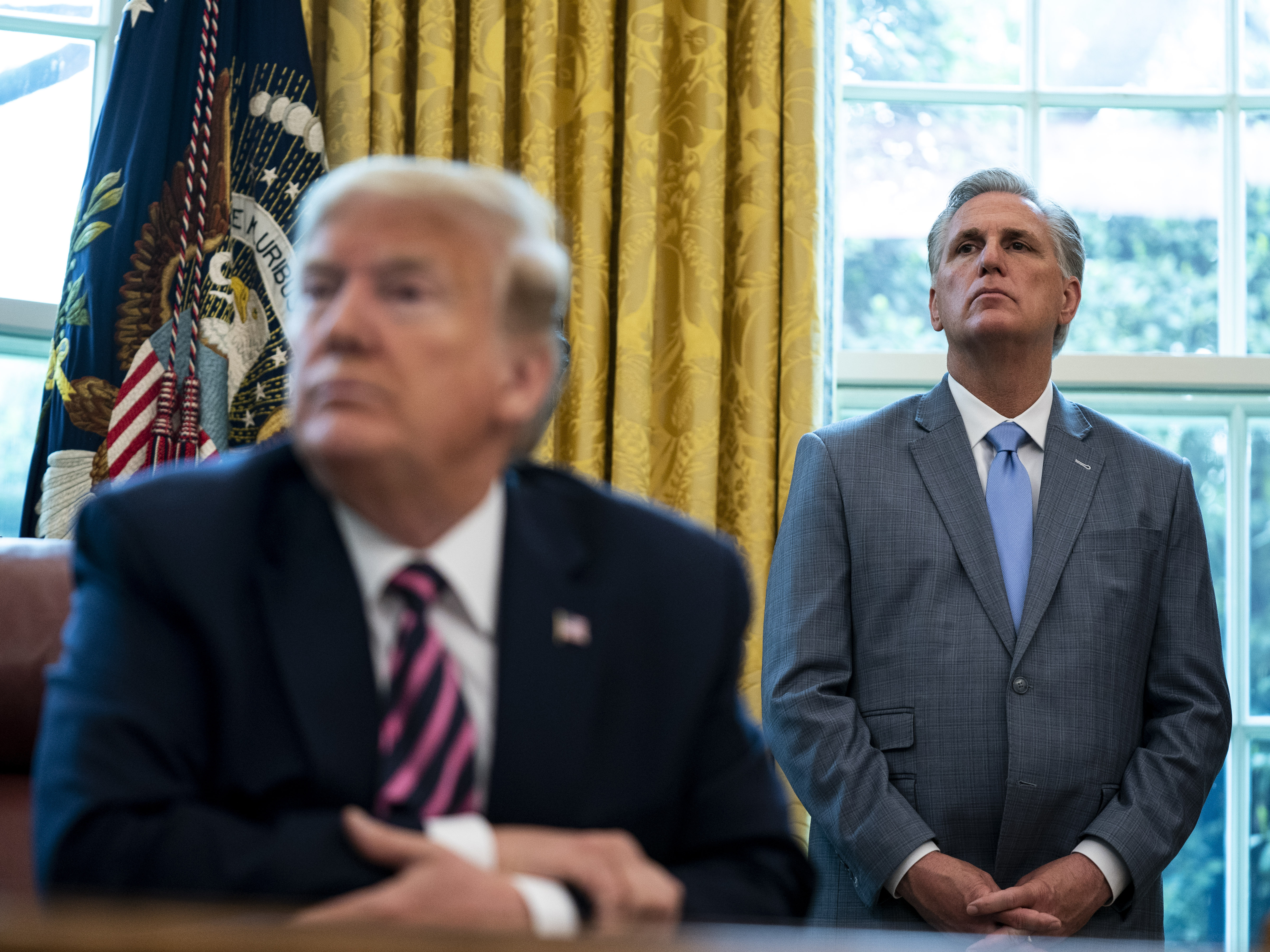 House Minority Leader Rep. Kevin McCarthy (R-CA) and U.S. President Donald Trump attend a signing ceremony for H.R. 266, the Paycheck Protection Program and Health Care Enhancement Act, in the Oval Office of the White House on April 24, 2020 in Washington, DC. (Getty Images)