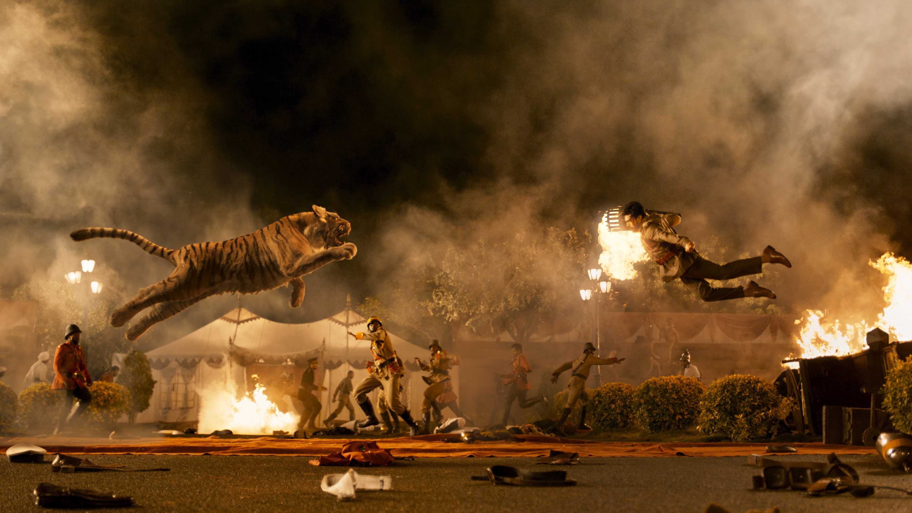 &quot;Naatu Naatu&quot; from the film <em>RRR</em> is up for best original song at the 95th Academy Awards. The tiger flying in the air toward Ram Charan (right), however, is not. (DVV Entertainment & Variance Films)