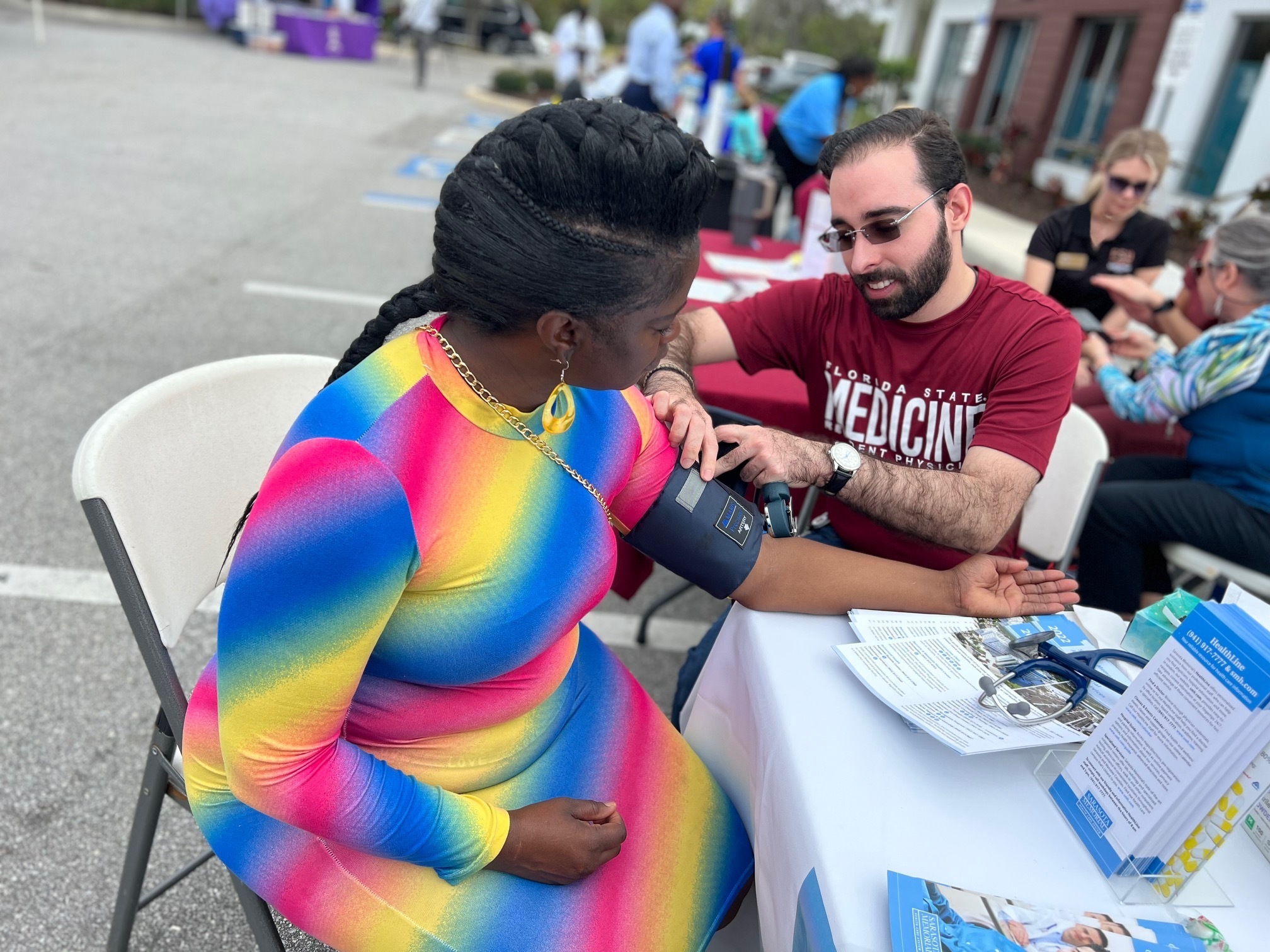 Substitute teacher Crystal Clyburn, 51, doesn't have health insurance. She got her blood pressure checked at a health fair in Sarasota, Fla. (Stephanie Colombini/WUSF)