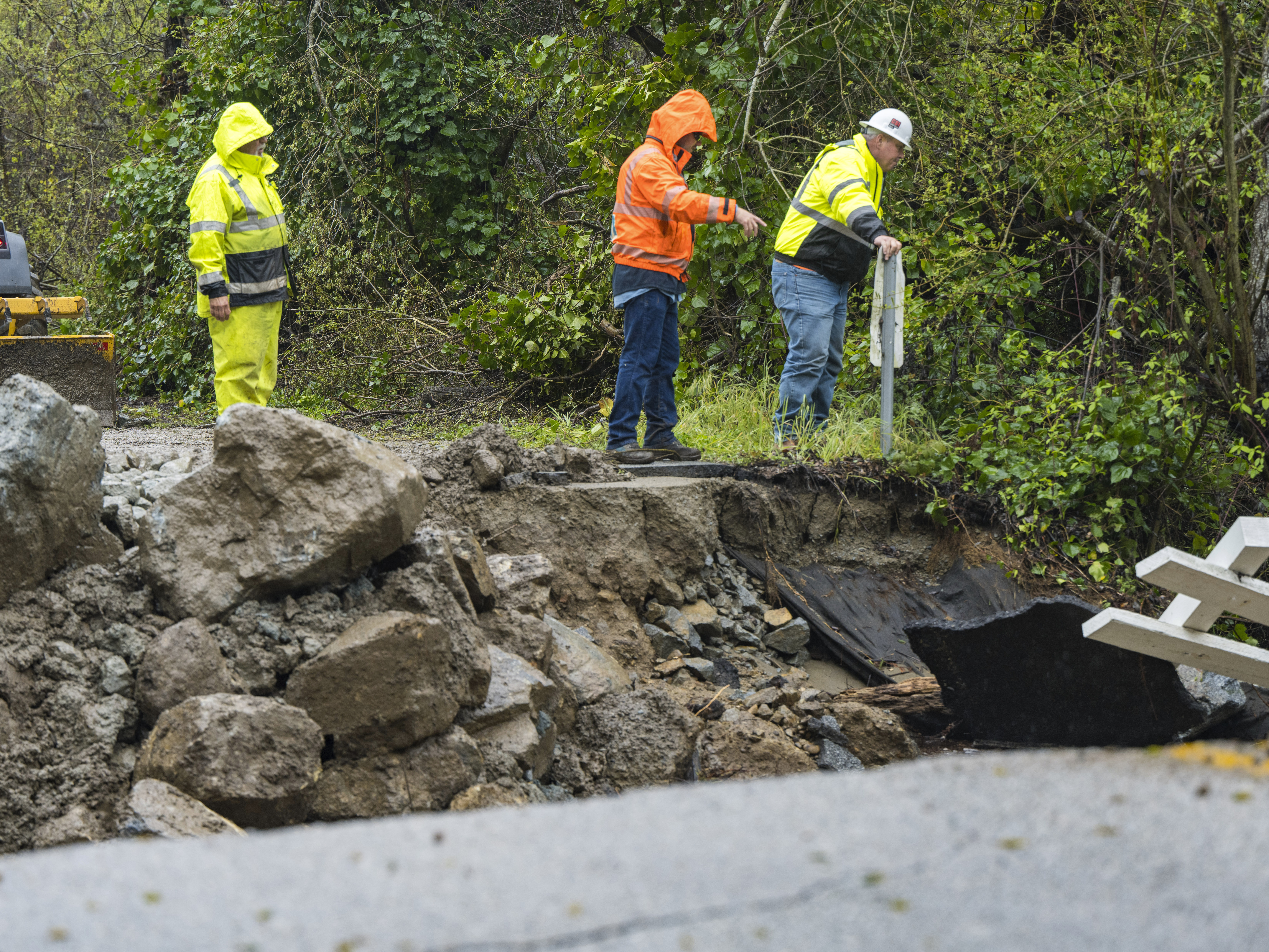 Two dead as nearly 13 inches of rain drench Central California 2 Crews assess storm damage, which washed out North Main Street in Soquel, Calif., on Friday.