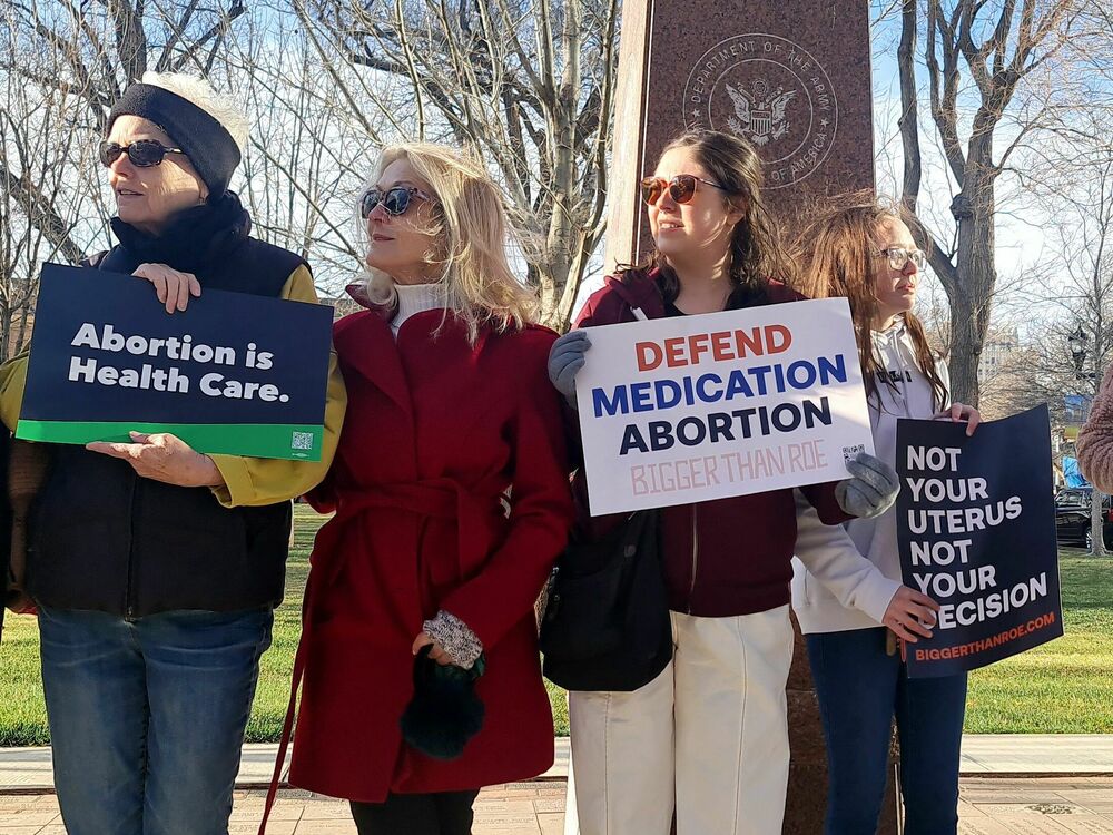 Abortion rights advocates gather in front of the J. Marvin Jones Federal Building and Courthouse in Amarillo, Texas, on Wednesday. U.S. abortion opponents are hoping to get a national ban on a widely used abortion pill through their lawsuit against the FDA. (AFP via Getty Images)