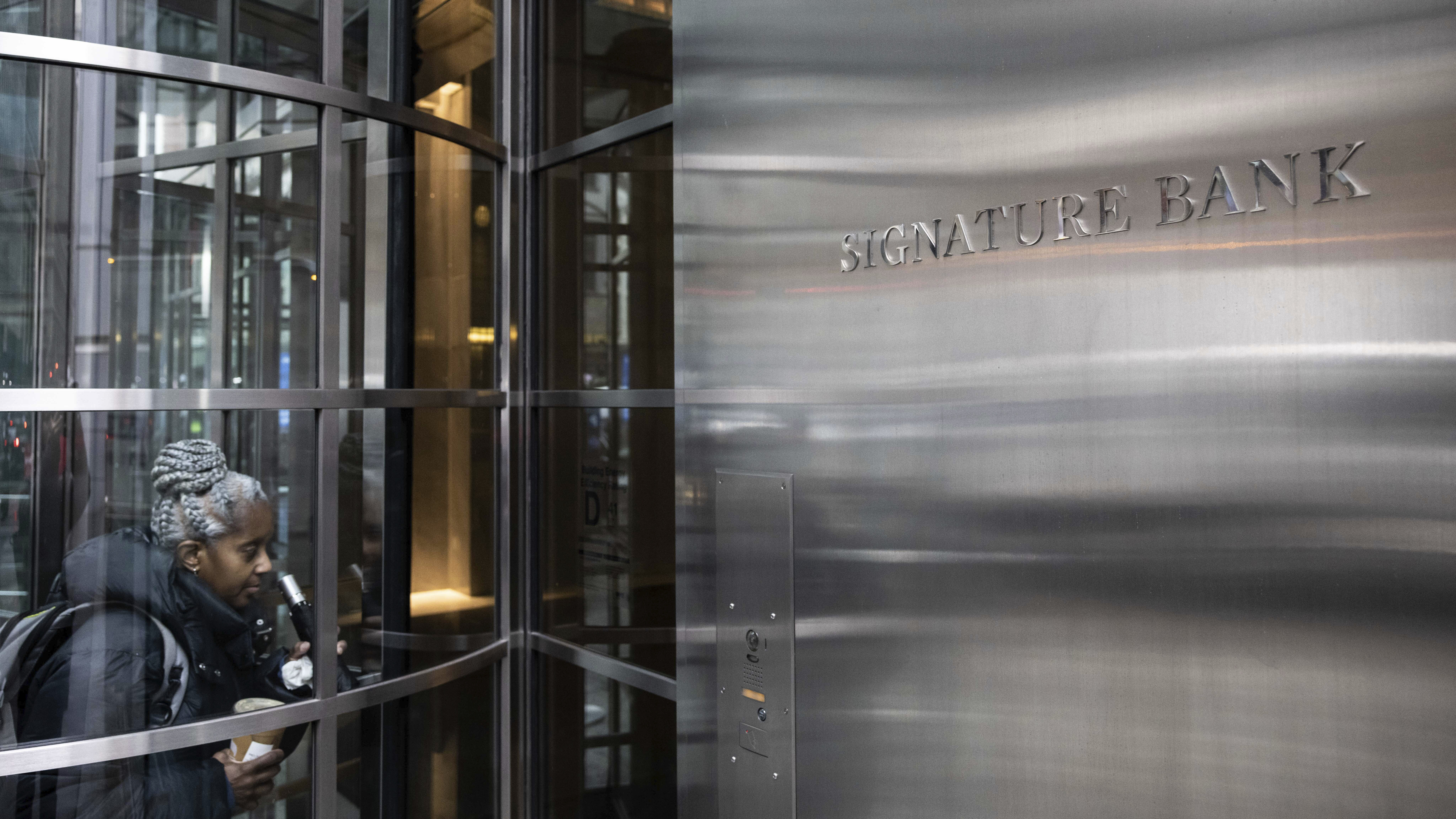 A person enters the Signature Bank headquarters in New York on March 13.