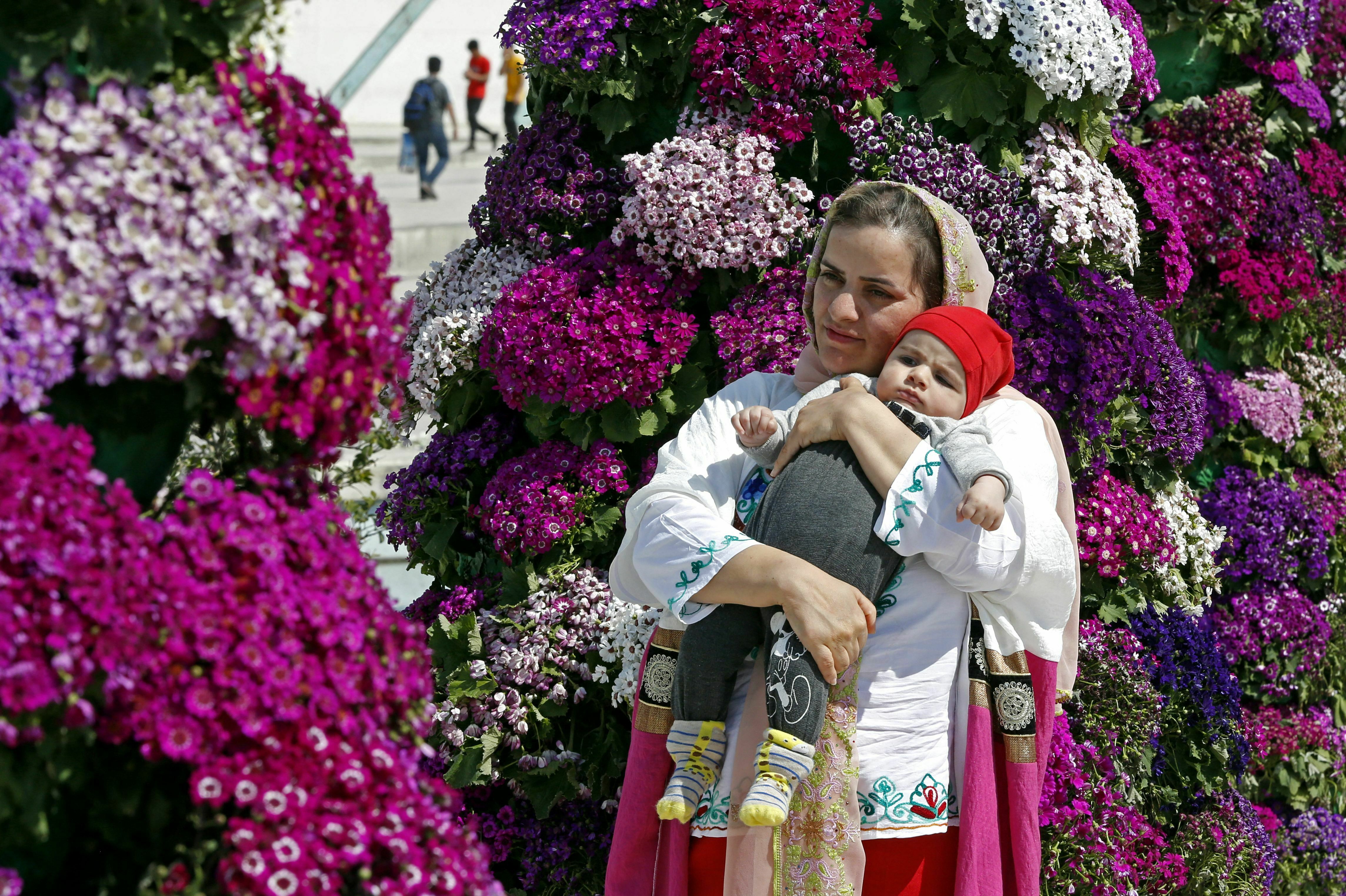 People gather in Tehran's Azadi Square on March 20, 2023 to celebrate Nowruz, the Persian New Year. (AFP via Getty Images)