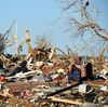 Mississippi and Alabama face a painful recovery after storms and a tornado killed 26