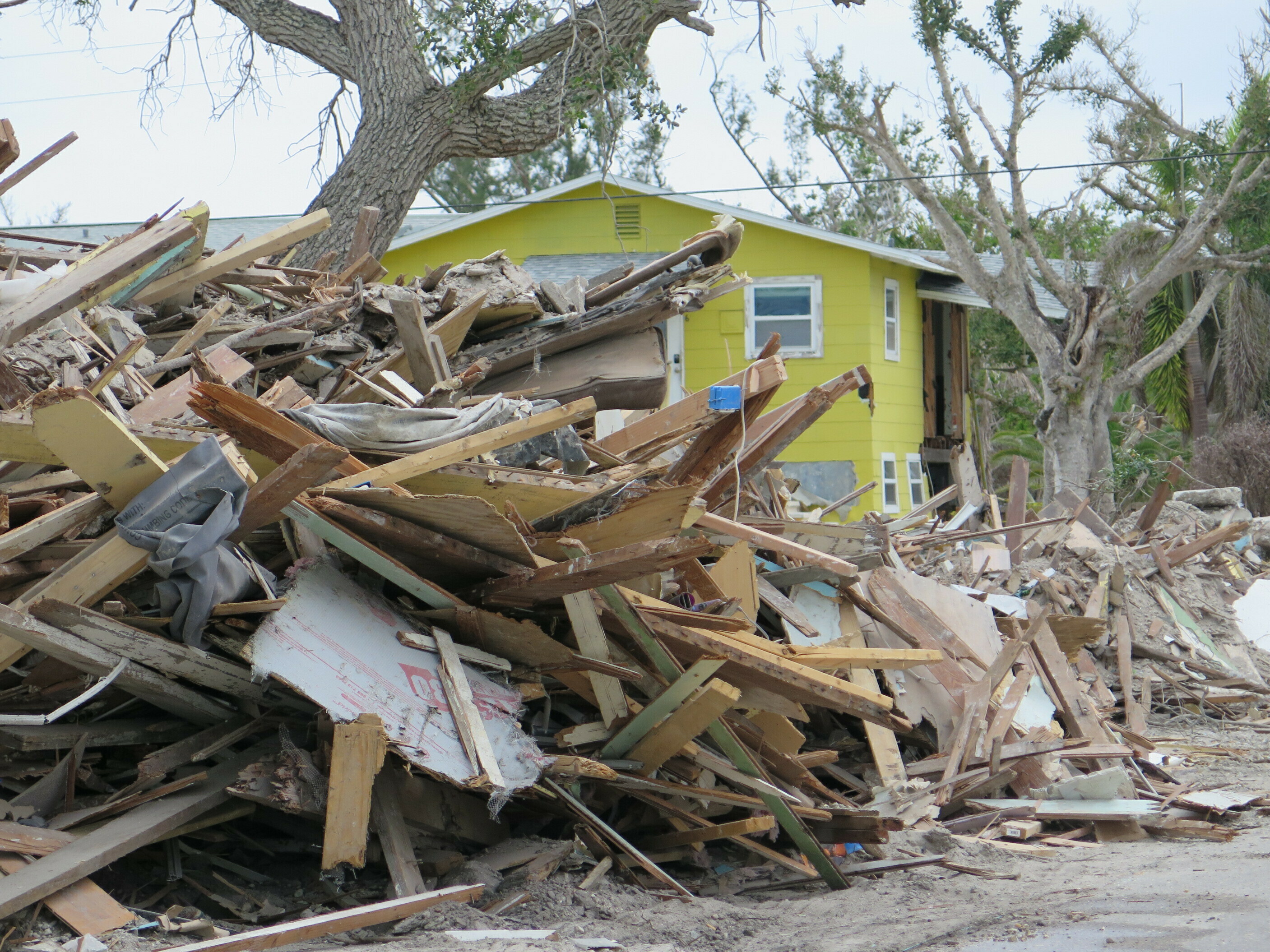 Six months after Hurricane Ian stormed across Southwest Florida, people in many areas are still struggling to rebuild. Fort Myers Beach was particularly hit hard by the 15-foot storm surge. (Greg Allen/NPR)