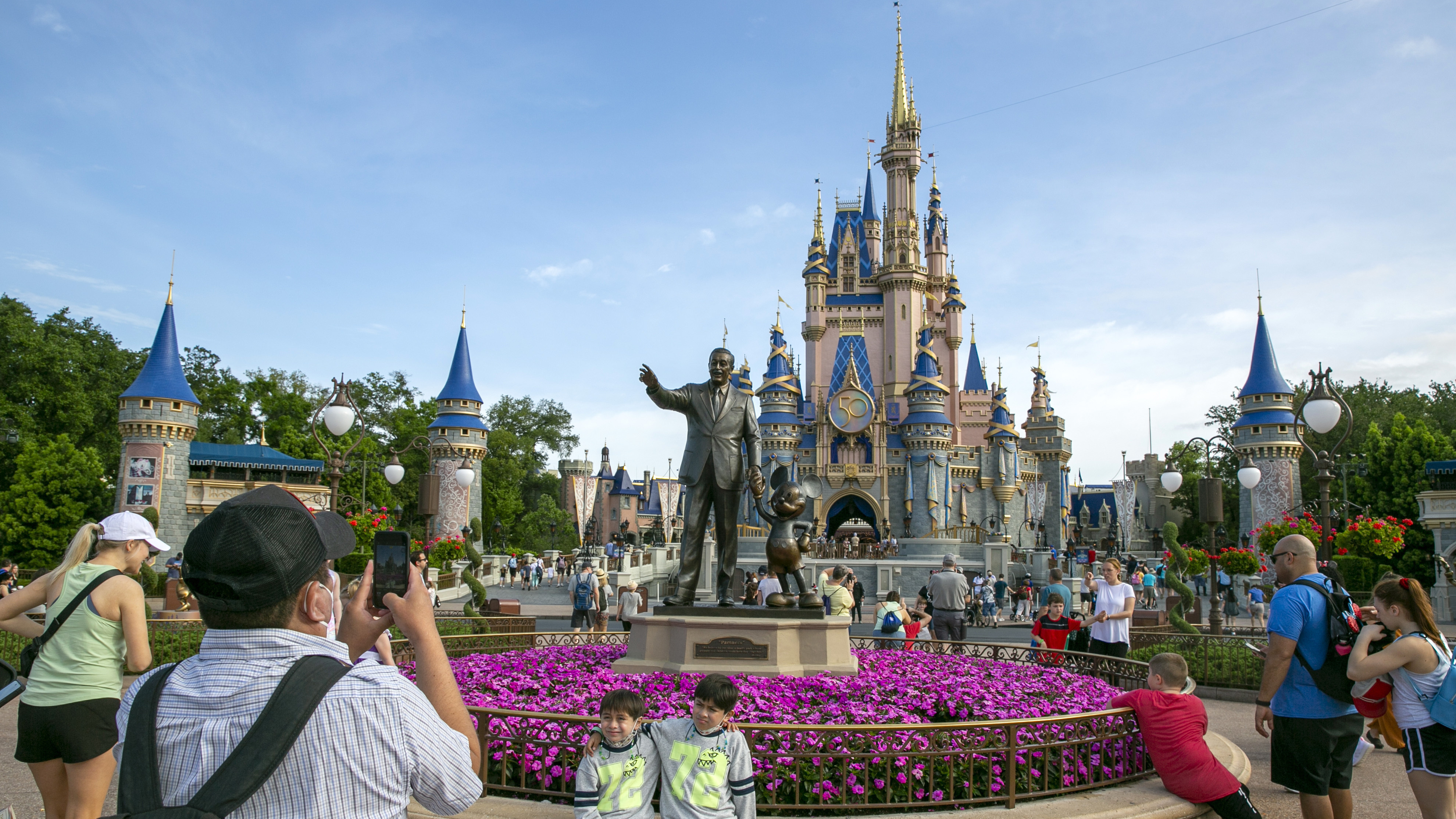 People visit Walt Disney World in Lake Buena Vista, Fla., on April 18, 2022.