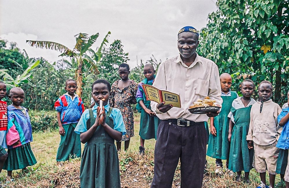 Members of the Abayudaya Jewish community of Uganda engage in the ritual of burning leavened foods before the Jewish holiday of Passover. There are some 2,500 Abayudaya Jews in the country. In the past they have faced persecution for their beliefs but are steadfast in their commitment to Judaism. (Emily Chaya Weinstein)