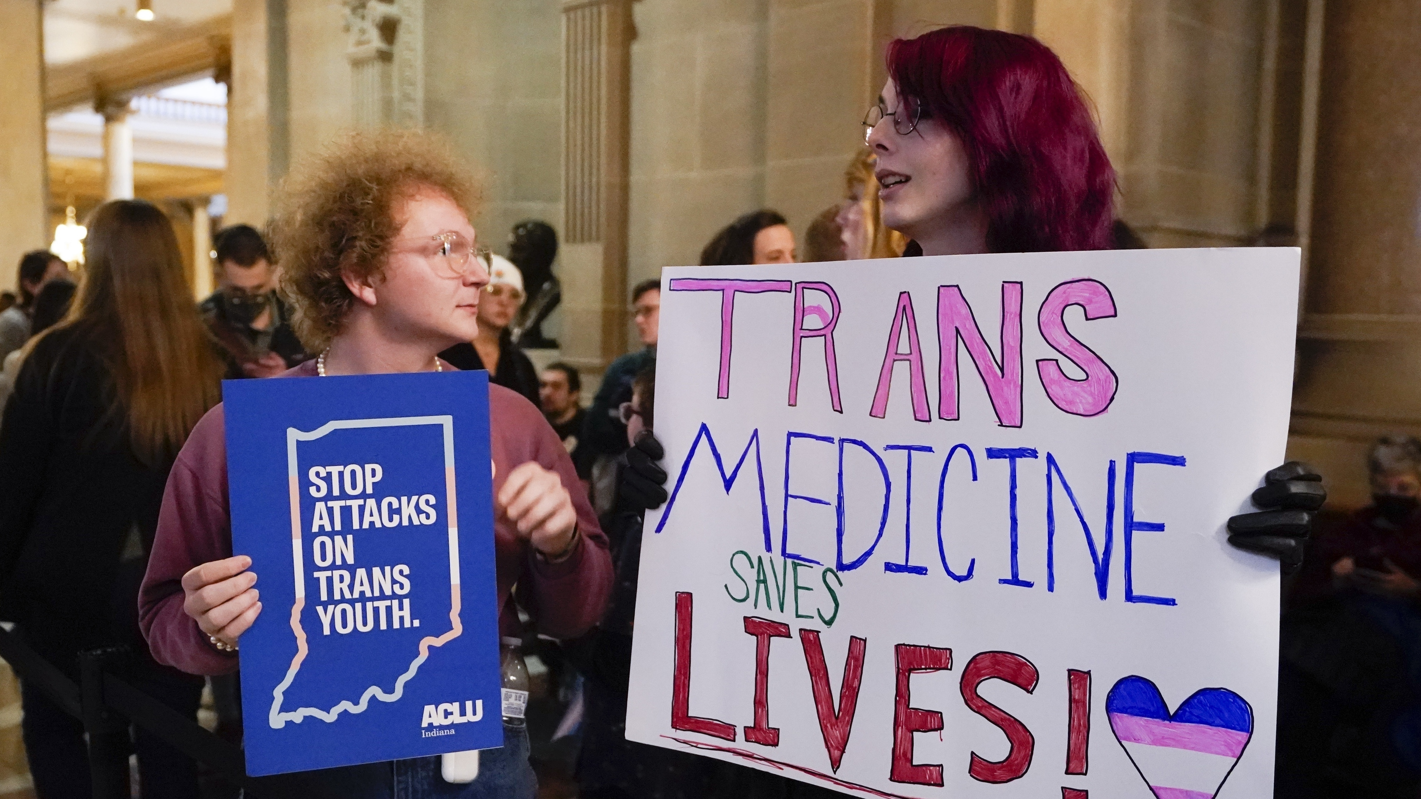 The governors from Indiana and Idaho sign bans on gender-affirming care