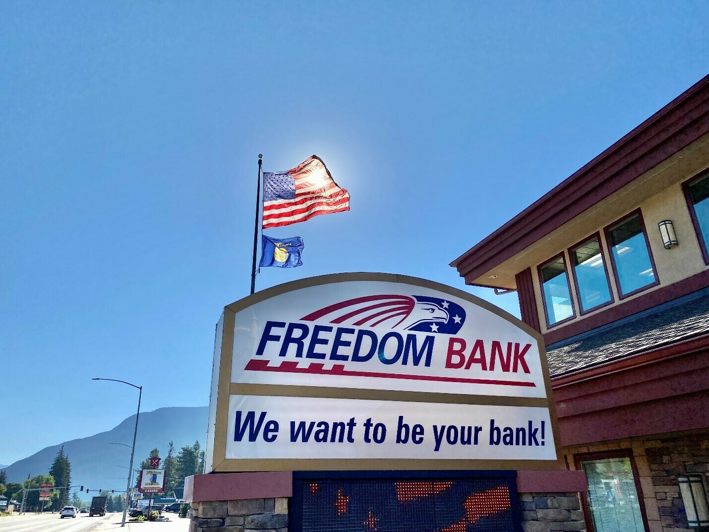 A sign is displayed for Freedom Bank in Columbia Falls, Mont. The community lender was founded over two decades ago and has grown its business by catering to locals. Its CEO, Don Bennett, says they should not be on the hook for recovering the cost of rescuing two failed banks. (Courtesy of Don Bennett)