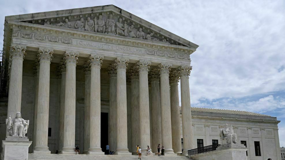People walk outside the U.S. Supreme Court in Washington, D.C., on Friday. (AFP via Getty Images)