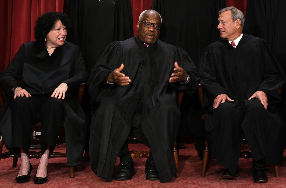 Supreme Court Justice Clarence Thomas poses with Justice Sonia Sotomayor and Chief Justice John Roberts pose for their official portrait in 2022. (Getty Images)