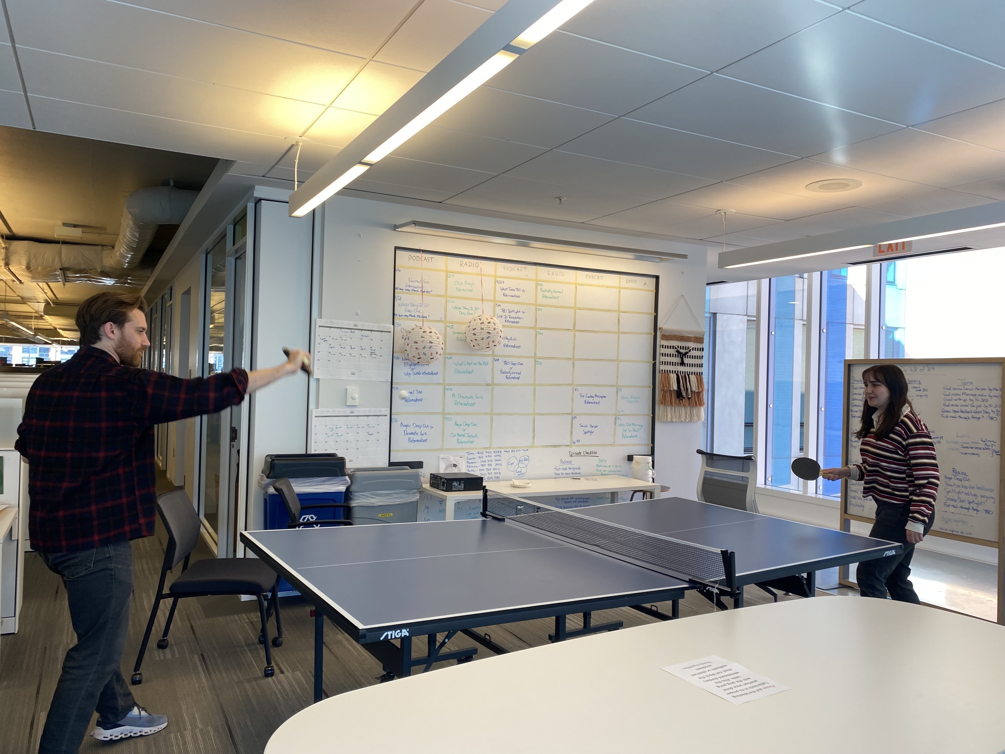 Kenny Malone (Co-host, Planet Money) and Susannah Broun play a mid-afternoon ping pong match.