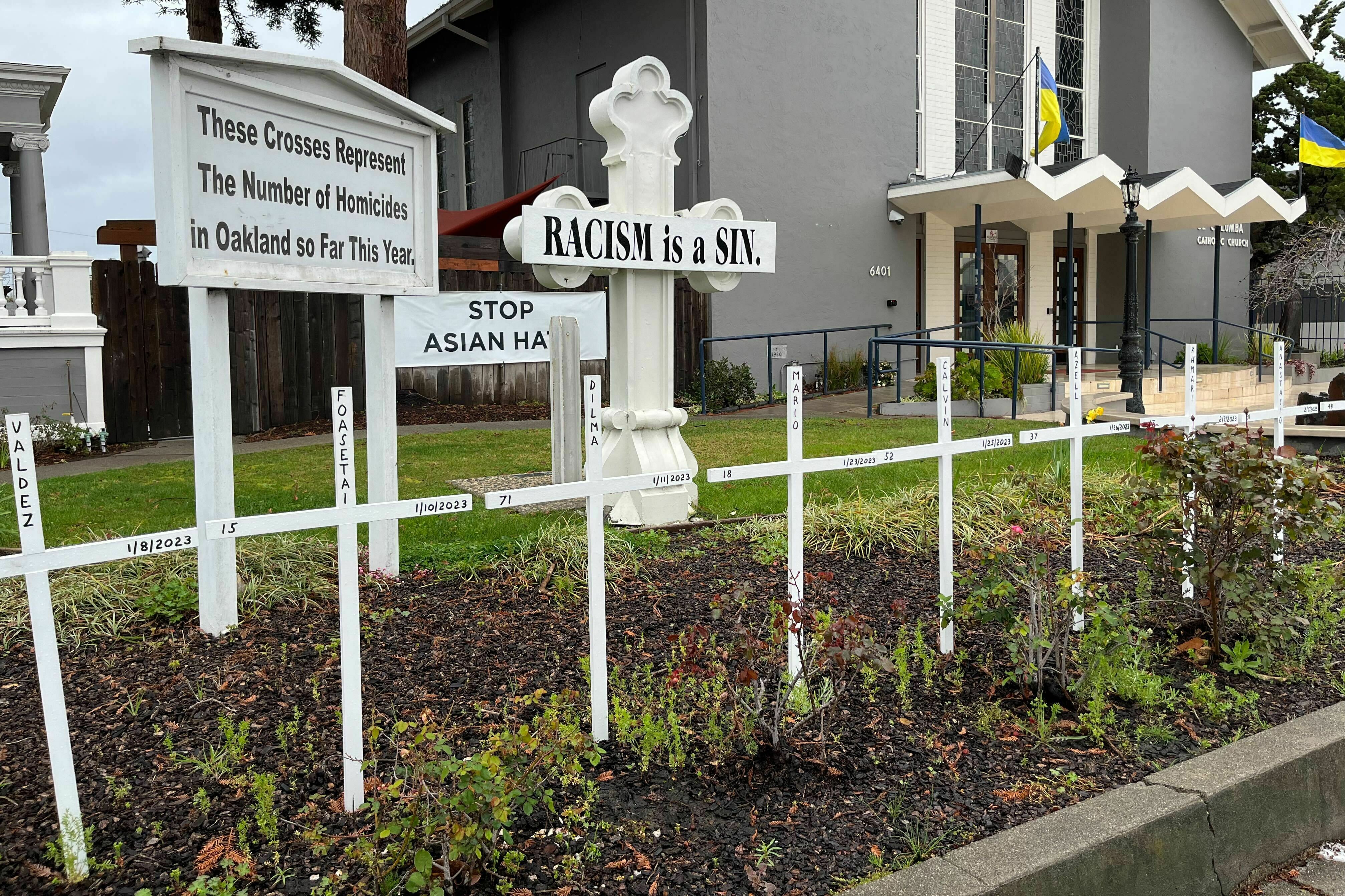Saint Columba Catholic Church in Oakland, Calif., commemorates every murder in the city with wooden crosses in its front garden. The city's homicide rate remains stubbornly high while its murder clearance rate remains well under the already low national average. (Eric Westervelt/NPR)