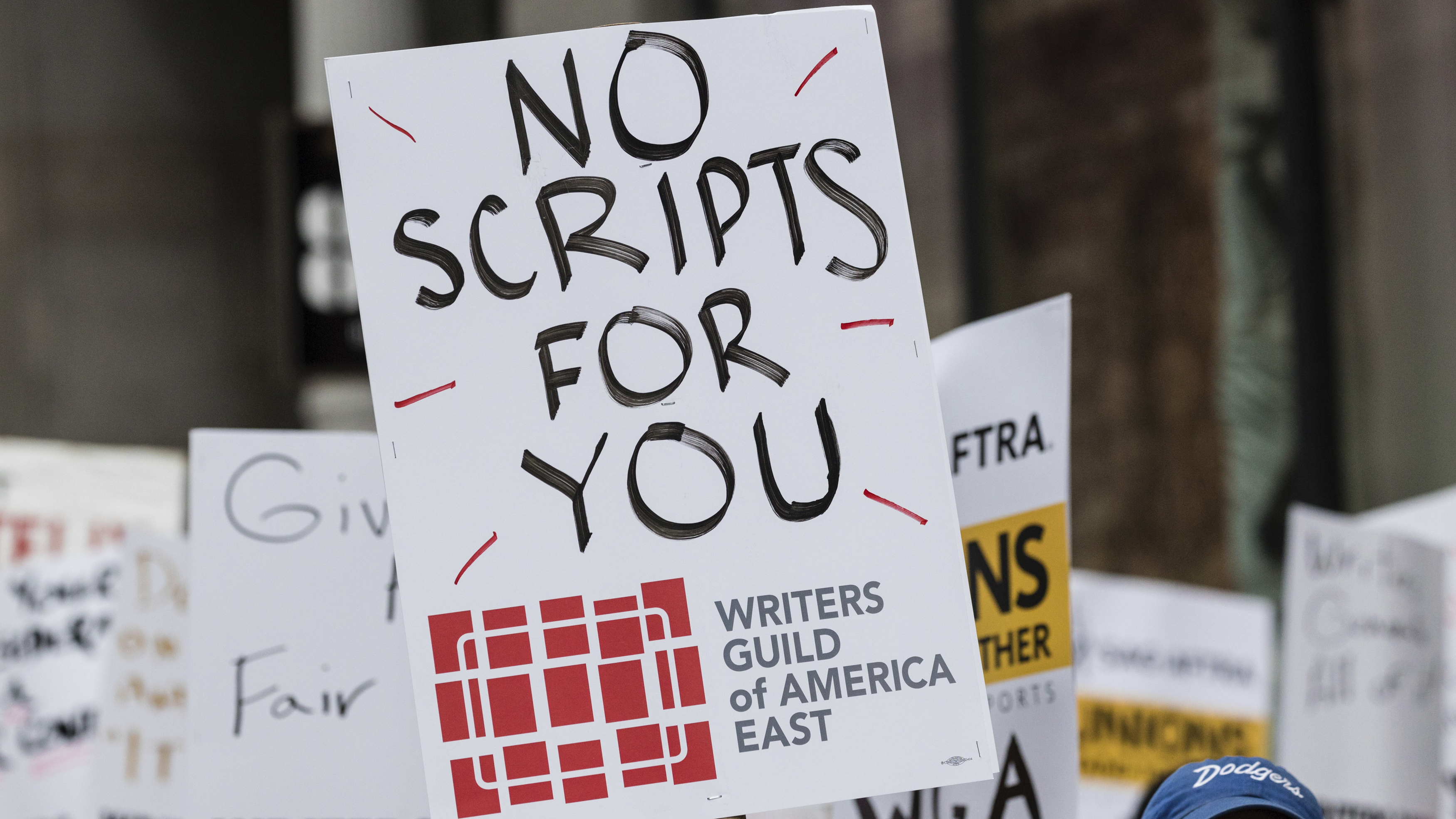 Members of the Writers Guild of America union picket outside Netflix headquarters Wednesday near Union Square in New York.