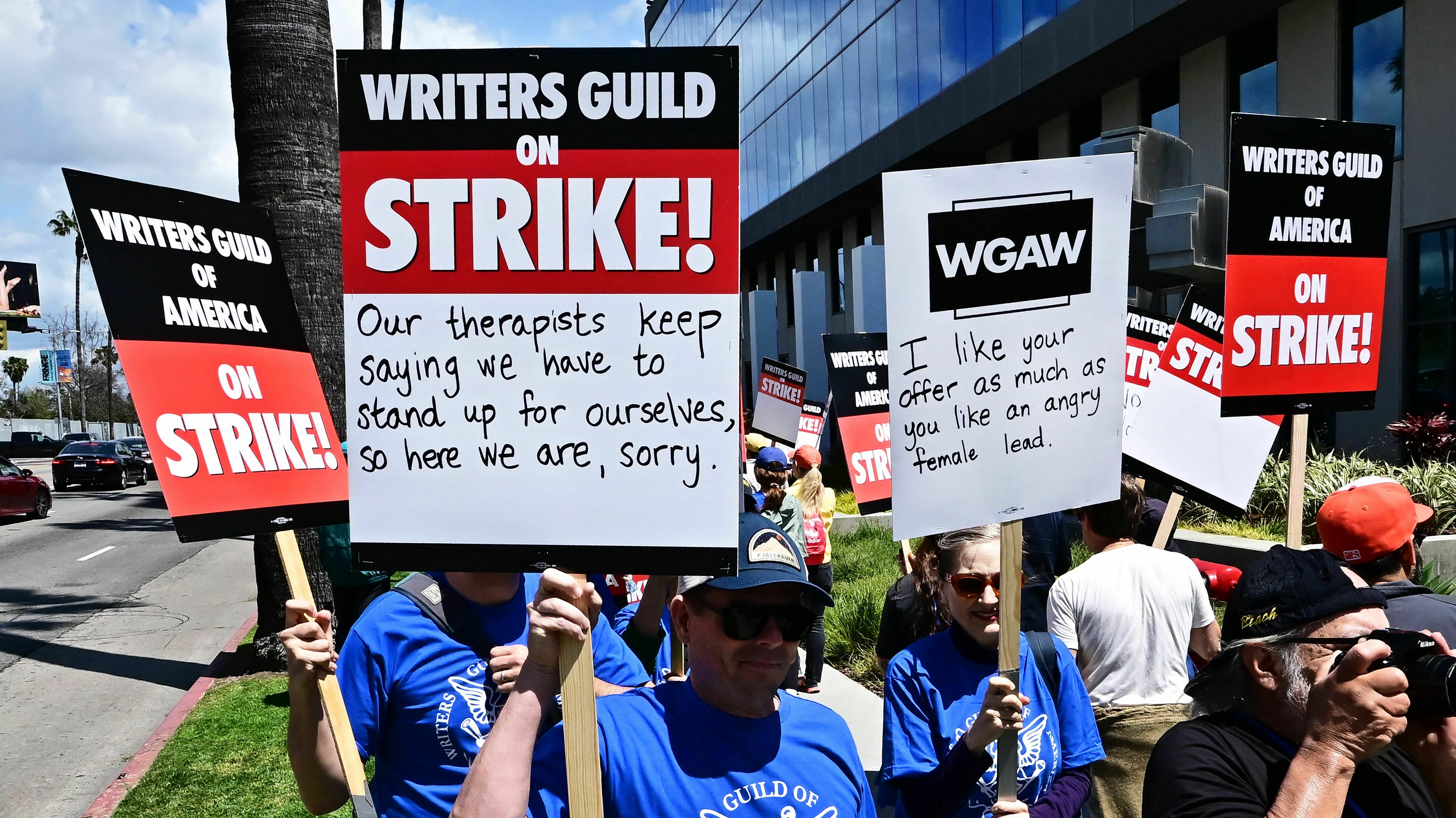 Writers picket in front of Netflix offices in Hollywood on Tuesday as the WGA strike began.