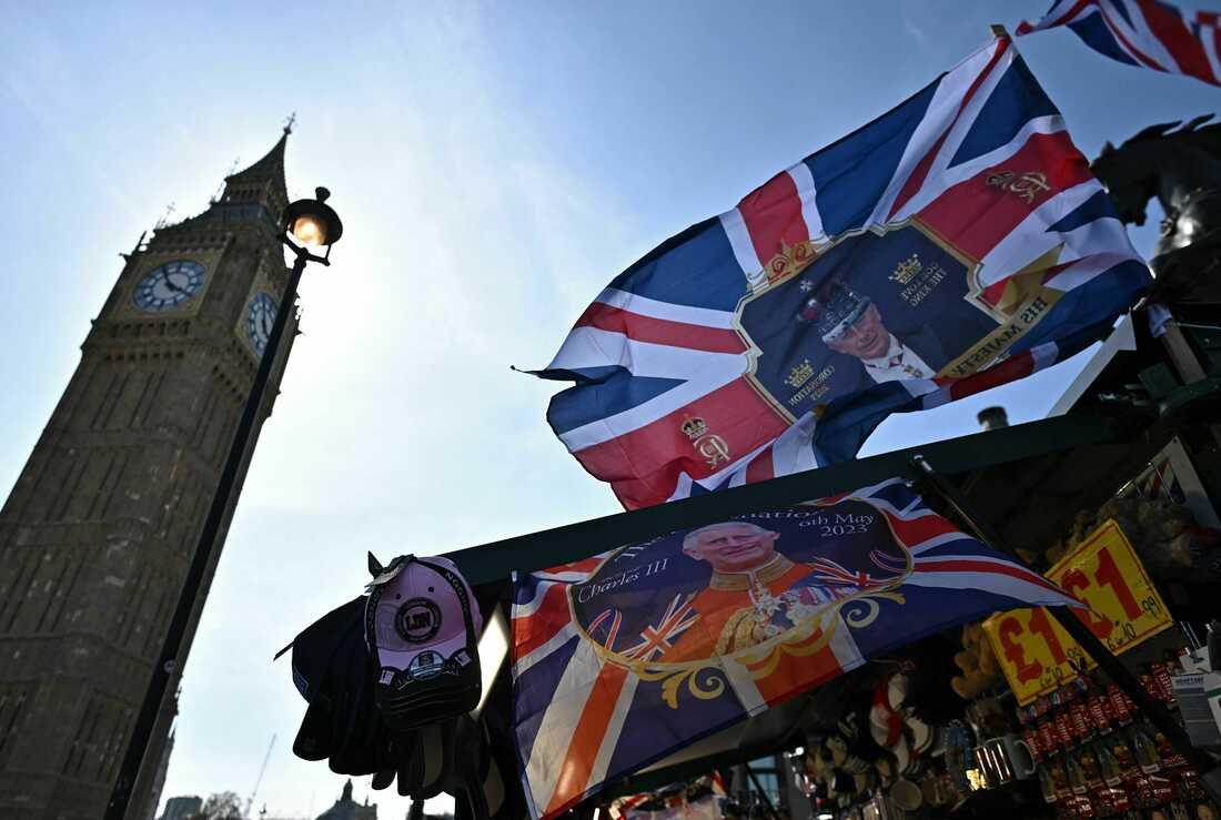 A coronation-themed United Kingdom flag is pictured at a souvenir stall near the Elizabeth Tower, more commonly known as Big Ben, of the Houses of Parliament in central London.