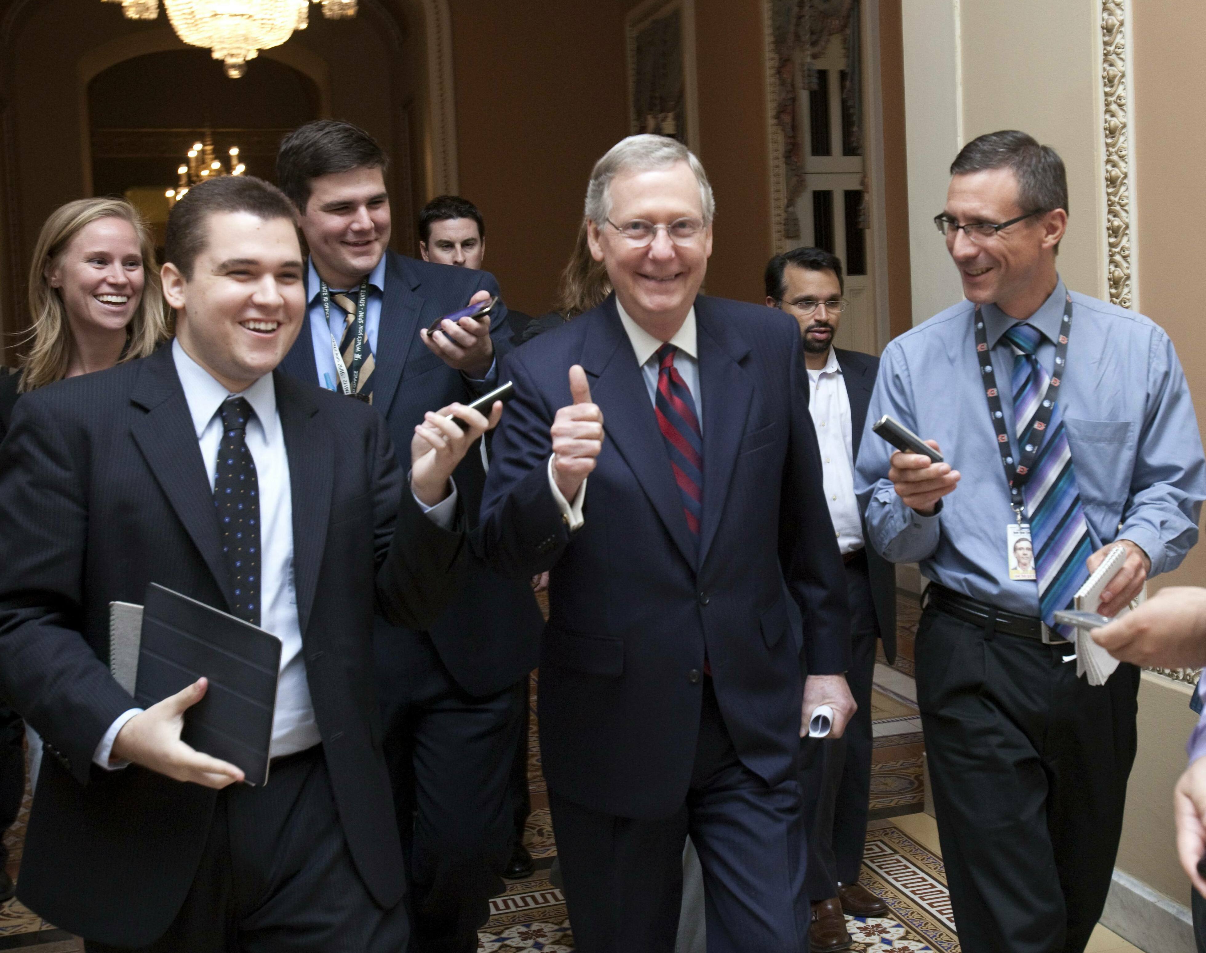 Senate Minority Leader Mitch McConnell, R-Ky., is all smiles as he walks to the Senate floor to announce that a deal has been reached on the debt ceiling on Capitol Hill in Washington on July 31, 2011.
