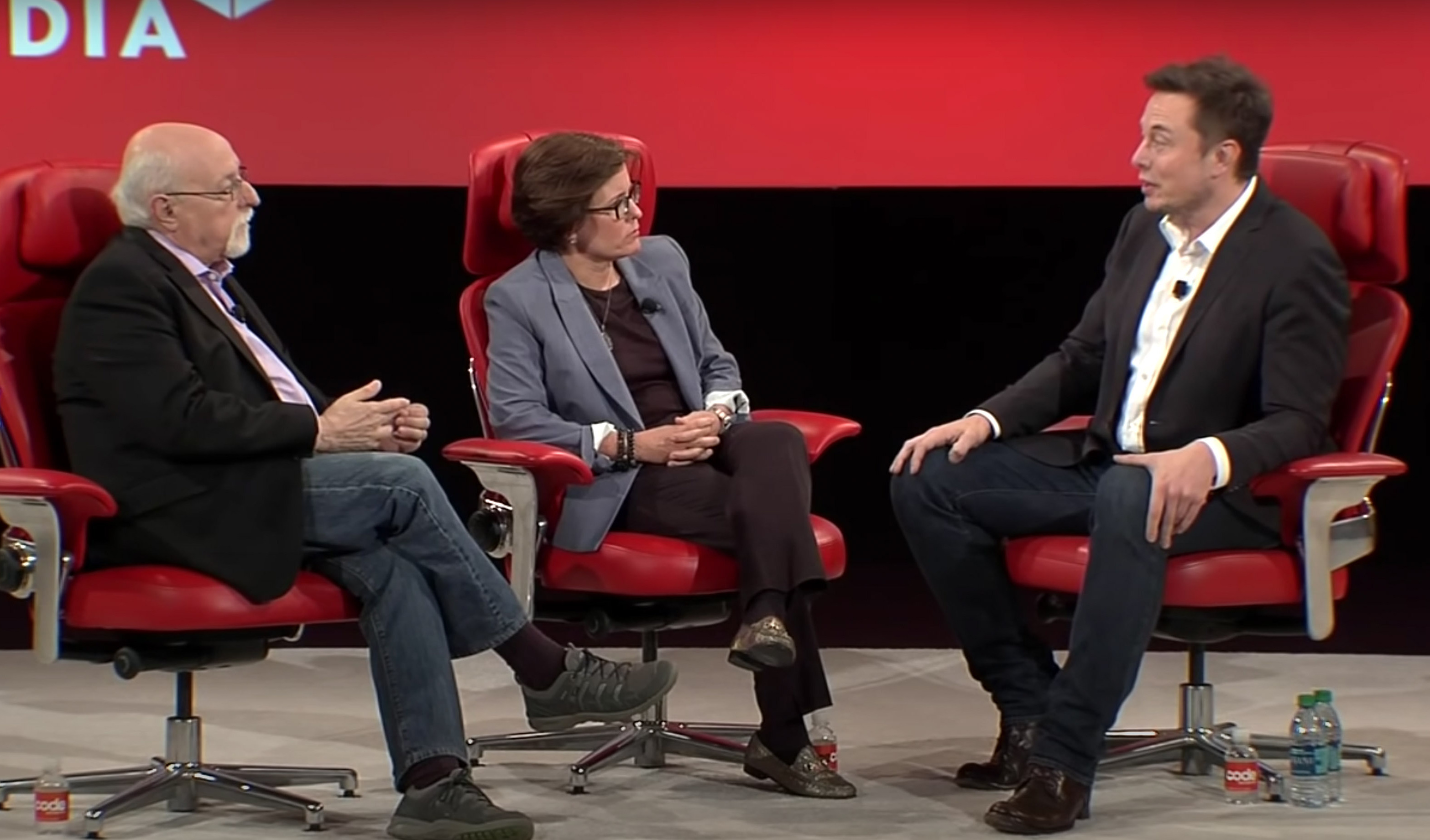 Elon Musk speaking to journalists Kara Swisher and Walt Mossberg at a conference in 2016. Musk's lawyers recently tried to argue in court that comments he made at that event could have been altered. (Recode/Screenshot by NPR)