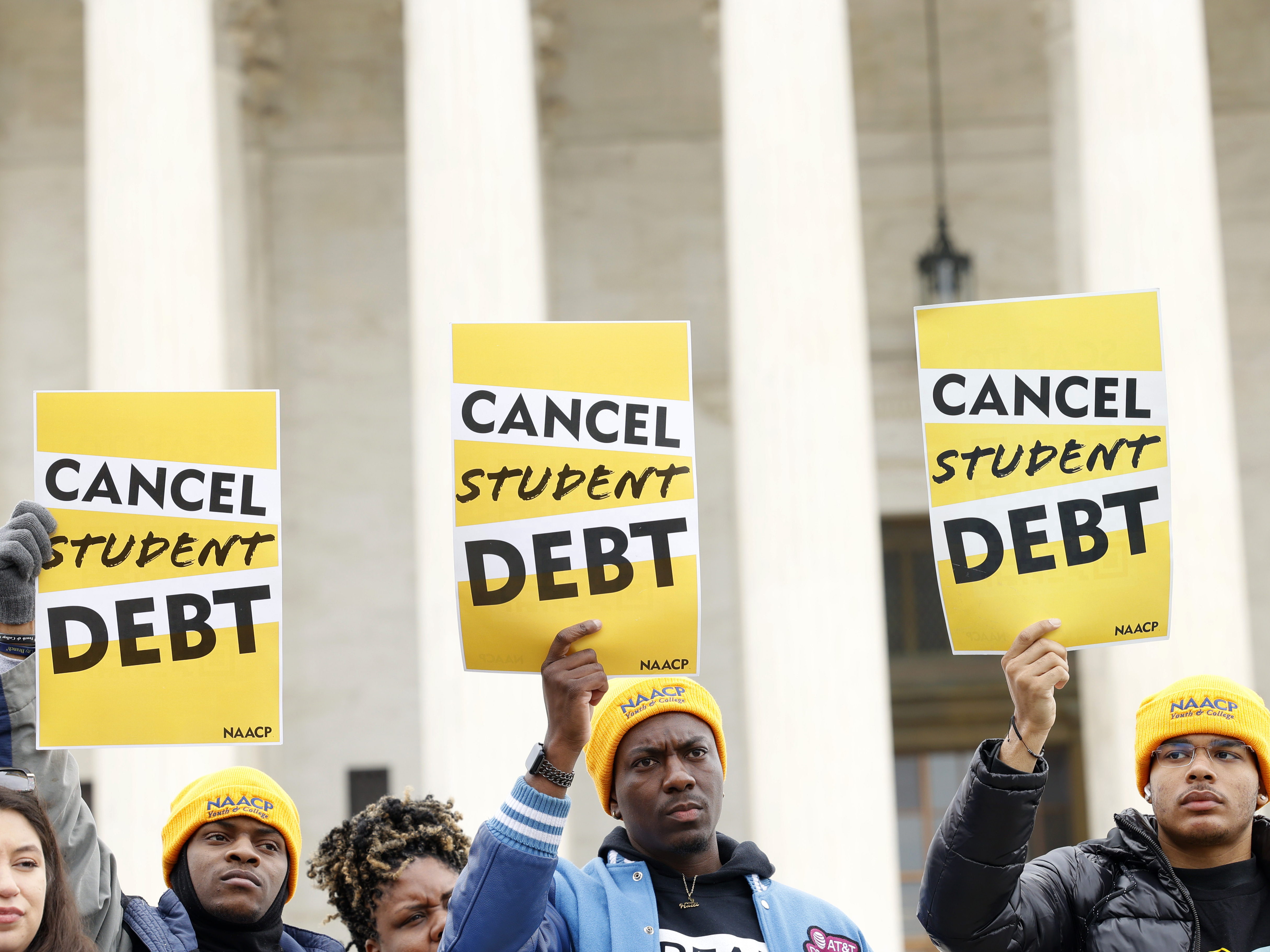 Student loan borrowers gather outside the Supreme Court building in February 2023. The court's ruling on President Biden's debt relief plan is expected in June or July. (Getty Images for People's Rally)