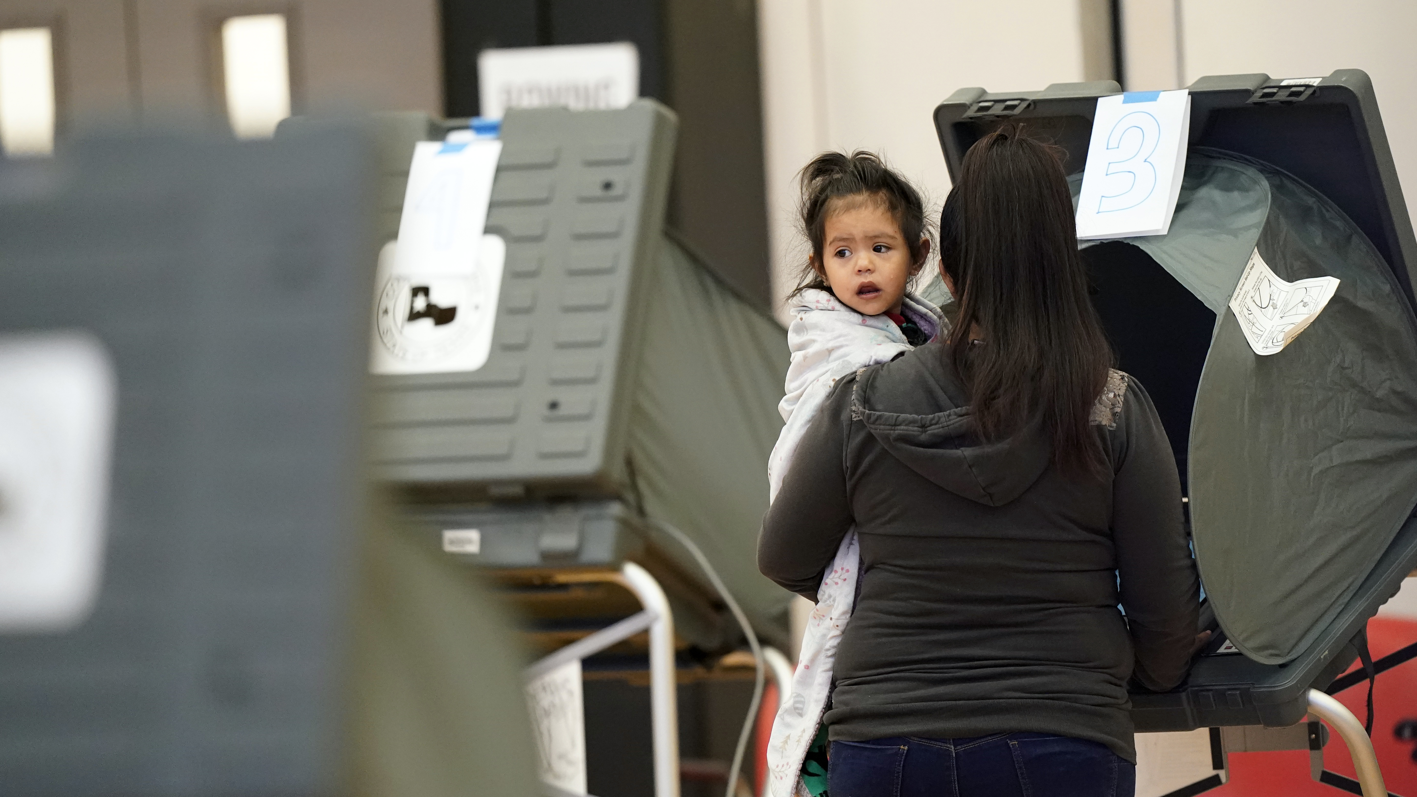 A voter and her daughter cast a ballot in Houston during the 2020 general election. New bills passed by Texas lawmakers target how elections are run in Harris County, which is home to Houston.