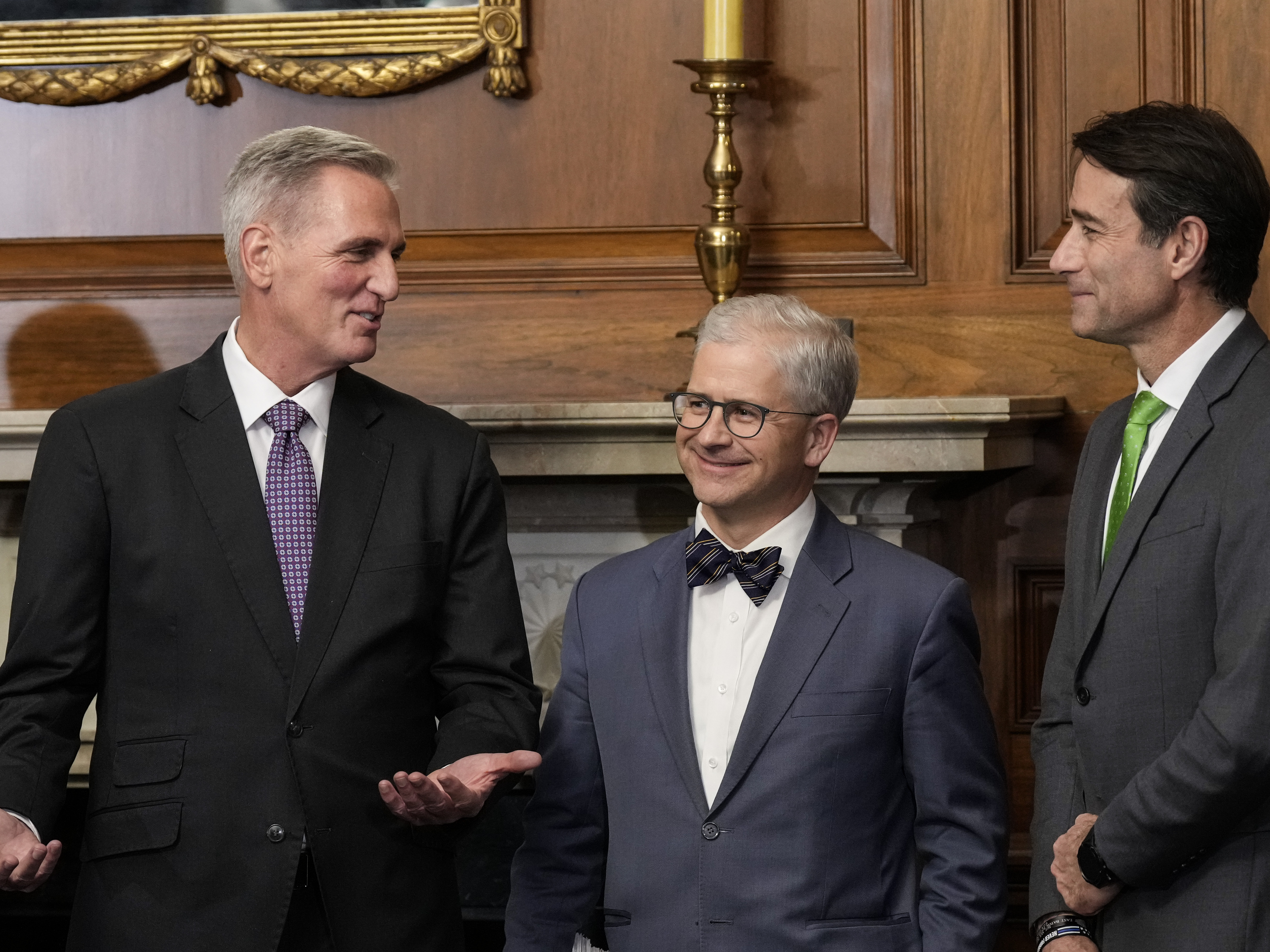 Speaker of the House Kevin McCarthy talks with Reps. Patrick McHenry and Garret Graves, his top negotiators for the debt ceiling bill, during a news conference after its passage in the House. (Getty Images)
