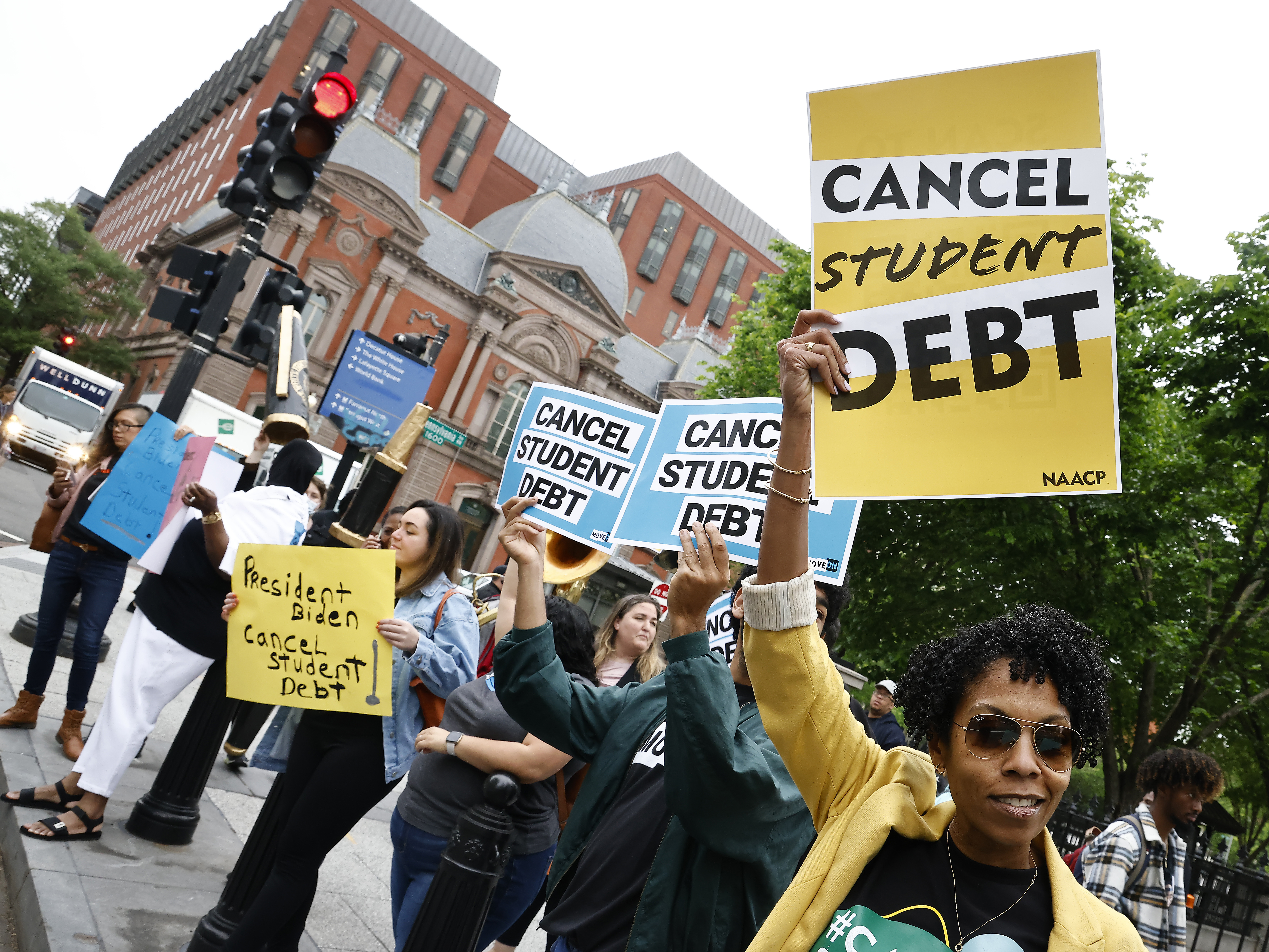 Student loan borrowers gather near The White House in May 2020. On Thursday, the Senate voted to repeal President Biden's plan to offer up to $20,000 in federal student loan debt relief. (Getty Images)