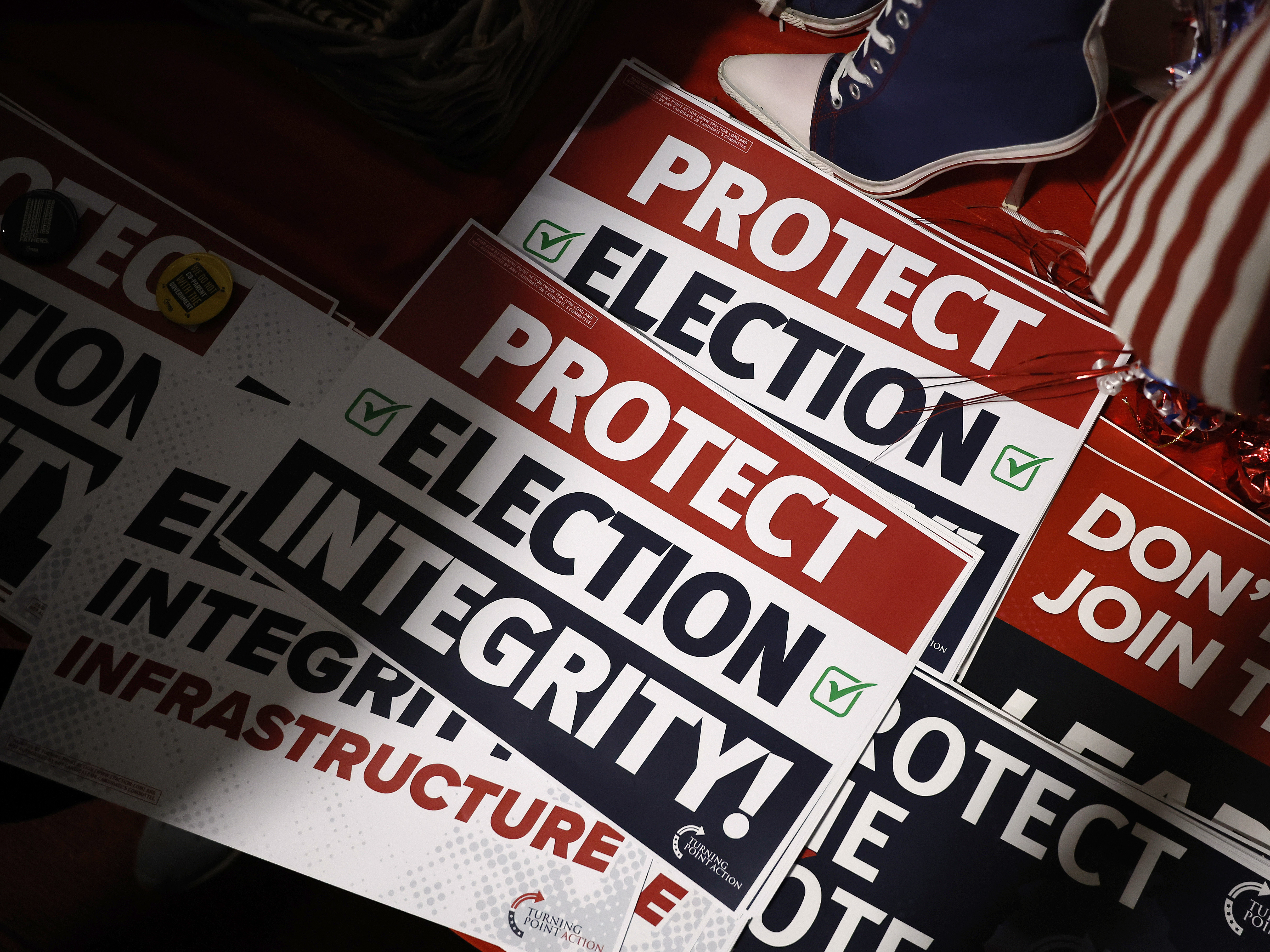 Placards are available for people to take during a campaign rally for Sen. Ron Johnson (R-WI) and Republican nominee for governor Tim Michels at the county Republican Party headquarters on November 05, 2022 in Waukesha, Wisconsin. (Getty Images)
